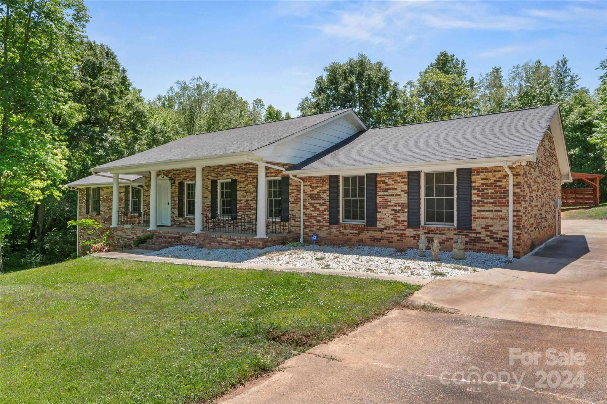 Nestled on a serene 1.5-acre cul-de-sac lot, this charming full-brick home is your ticket to peaceful living with tranquil creek running through back of property. As you approach the home, you're welcomed by an inviting rocking chair front porch. The interior boasts newer flooring throughout and a versatile media room, perfect for cozy movie nights or working out at home. The unfinished basement is a blank canvas, providing endless possibilities for storage, a hobby room, or your dream workshop. With no pesky HOA fees to worry about and a recently added carport, this home offers the perfect blend of privacy and convenience. Come experience the tranquility and comfort this home has to offer.