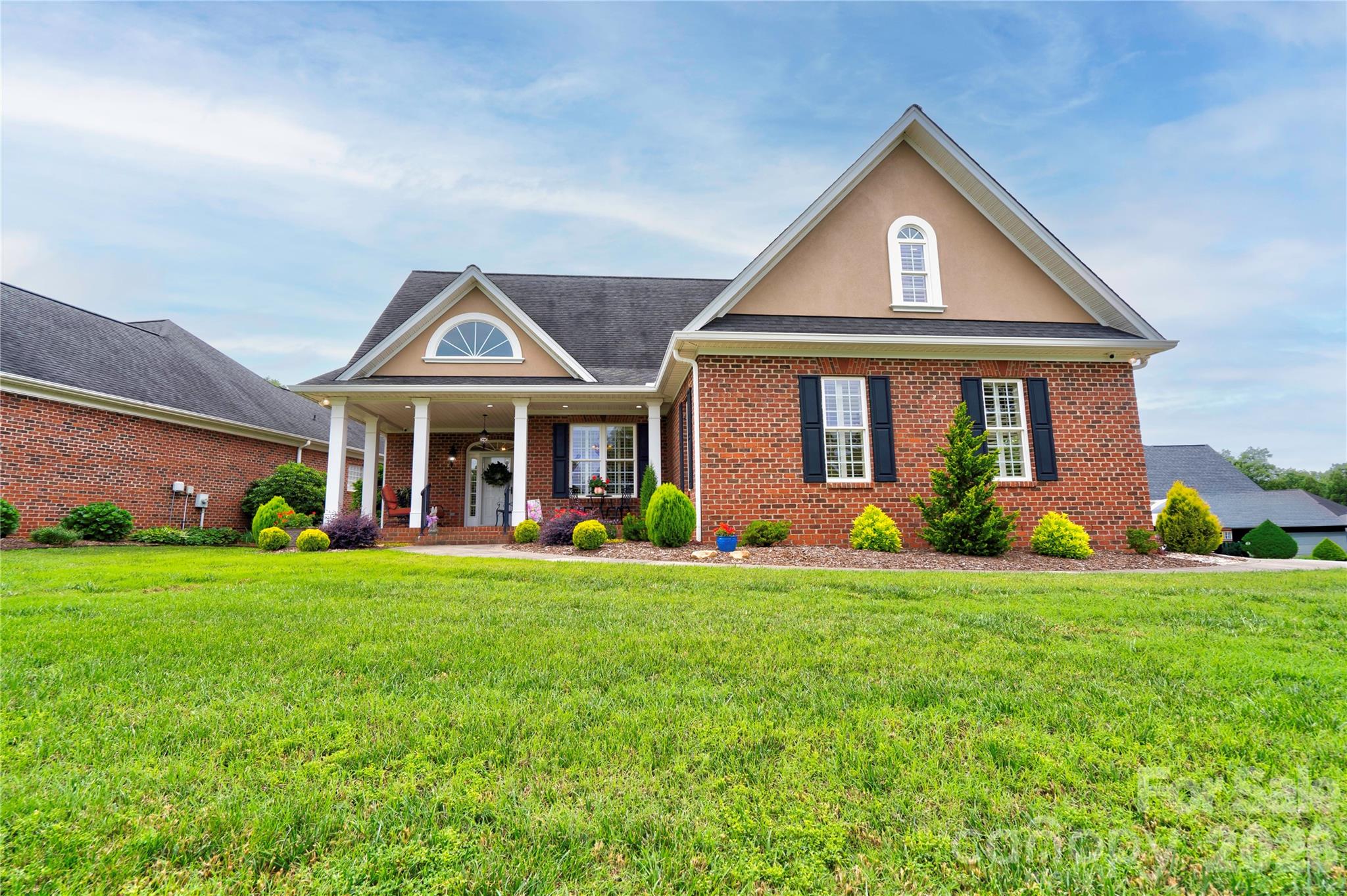 Welcome to this beautifully maintained patio home located in The Knoll at Spring Forest! Featuring a timeless full brick exterior with elegant stucco accents, this spacious 3-bedroom, 3-bath home offers a thoughtfully designed split floor plan and low-maintenance living.  The main level includes a generous primary suite complete with a sitting area, walk-in closet plus an additional closet, and a luxurious en-suite bath featuring a double vanity and large tiled shower. A second bedroom and full bath are also conveniently located on the main floor.  The well-appointed kitchen offers granite countertops, black appliances, and a bright breakfast room, while the dining room showcases vaulted ceilings that create an open and inviting atmosphere. A spacious laundry room with cabinetry and additional storage closet adds everyday convenience.  Upstairs, you'll find a versatile third bedroom or bonus room with its own private bath, making it ideal for guests, a home office, or hobby space. Storage is abundant with a large walk-in attic.  Enjoy relaxing mornings on the covered front porch and peaceful evenings on the covered rear porch overlooking the beautifully landscaped yard. This exceptional home combines comfort, functionality, and curb appeal in one of the area's most desirable communities.