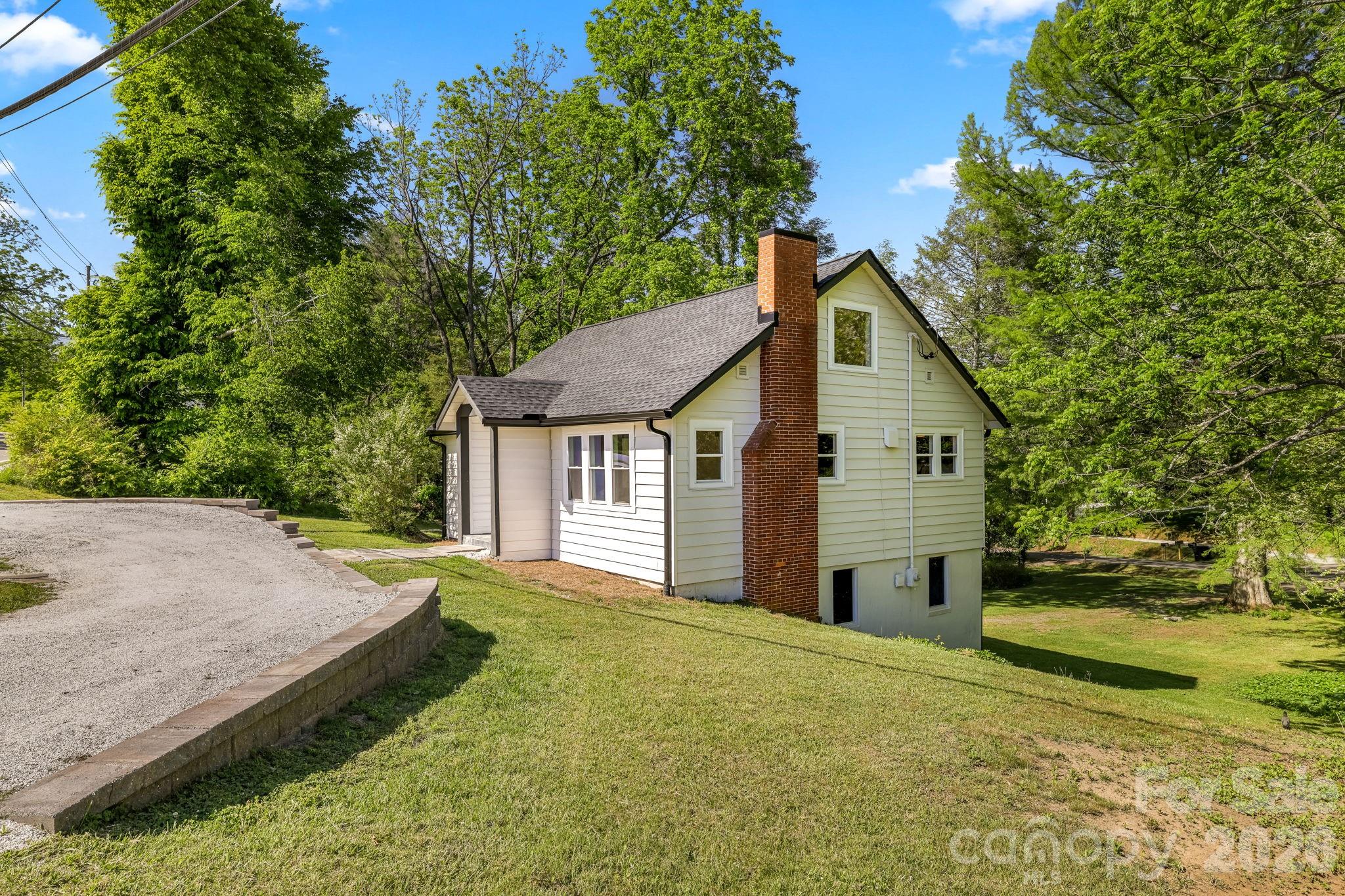 Welcome to the perfect family home right in the heart of Franklin! Located safely within the city limits, this completely remodeled 3BR/2BA property offers all the peace of mind of new construction without the wait. Say goodbye to well and septic maintenance—this home is fully connected to public city water and sewer for ultimate, worry-free convenience! Every major system has been updated for your family's comfort, including a brand-new roof, high-efficiency heat pump, and new windows. The partially encapsulated basement is a parent's dream, offering incredibly clean, dry storage for bikes, strollers, and outdoor gear. Inside, vaulted ceilings and a bright, open floor plan make it easy to keep an eye on the little ones. The beautiful, chef-inspired kitchen features granite countertops and easy-to-clean GE stainless steel appliances, ready for busy weekday breakfasts and family dinners. The main level provides two bedrooms and two fully updated bathrooms showcasing elegant, durable ceramic tile. Upstairs, the private third bedroom is incredibly versatile, making a perfect playroom, teen hangout, or quiet homework station. Enjoy a highly walkable, stroller-friendly lifestyle just steps from downtown Franklin's family events, local treats, and shops. Completely move-in ready and low-maintenance—your family's next chapter starts here!