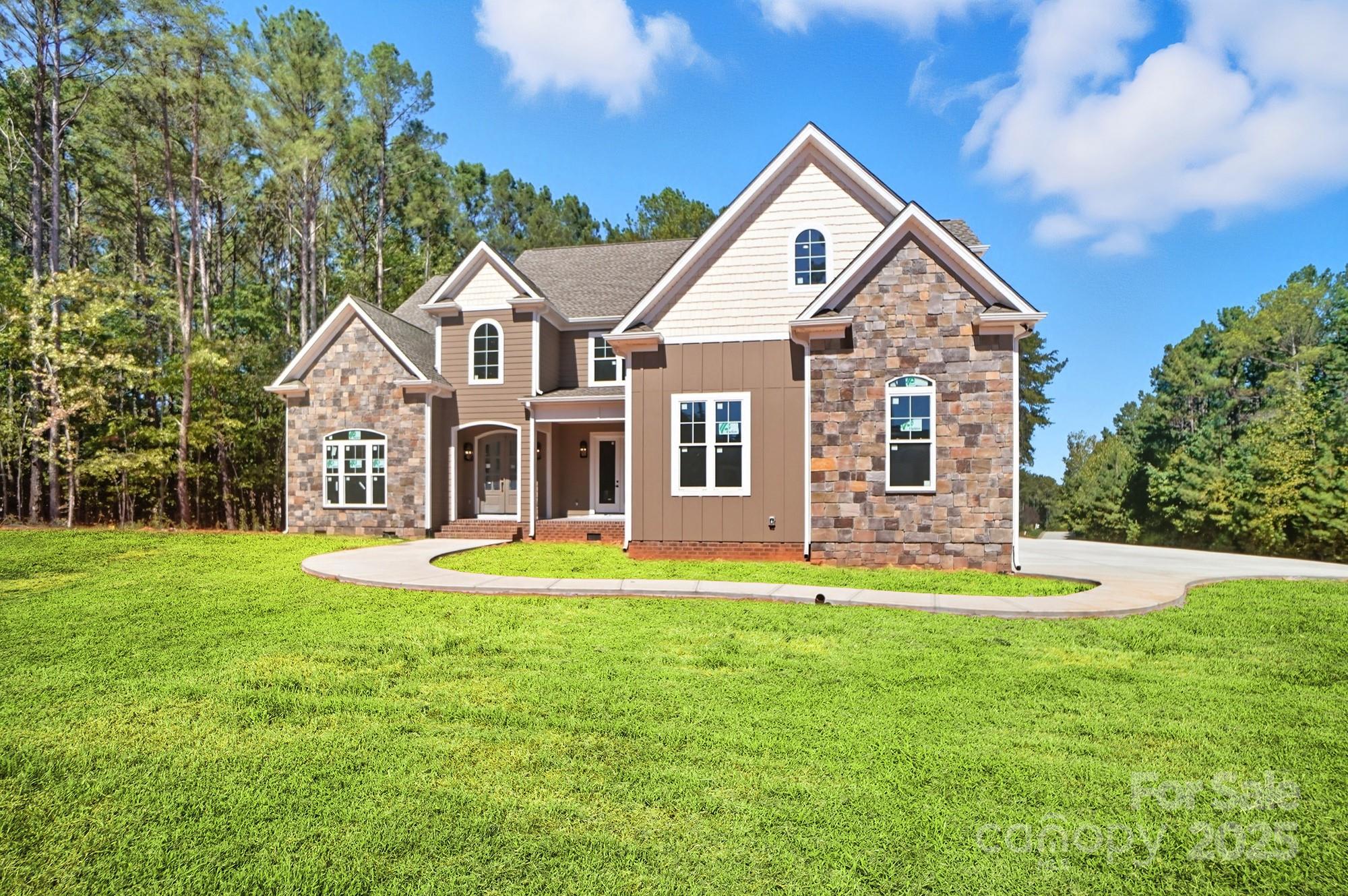 Stunning New Construction in Handsmill Lake Community! Welcome to your dream home. Nestled on a large, private, wooded lot surrounded by protected land that can not be developed, this brand-new custom-built residence offers the perfect blend of luxury, privacy, and natural beauty. Crafted by a highly sought-after custom builder, this home was thoughtfully designed with high-end finishes and an abundance of space. The gourmet kitchen is a true showstopper, featuring tons of custom cabinetry and an oversized walk-in pantry so spacious it functions as a second kitchen—perfect for entertaining or keeping the main space clutter-free. The main-level primary suite offers convenience and comfort, while upstairs you’ll find four additional oversized bedrooms, each with generous closet space. There’s also a dedicated first-floor office, ideal for remote work or a quiet retreat. Enjoy peaceful mornings and relaxing evenings on both your covered front and back porches, overlooking serene, wooded surroundings. The spacious 3-car garage offers ample storage and room for all your vehicles or hobbies. 
Located in a desirable lake community, you’ll enjoy access to water recreation, scenic views, and a tranquil lifestyle.