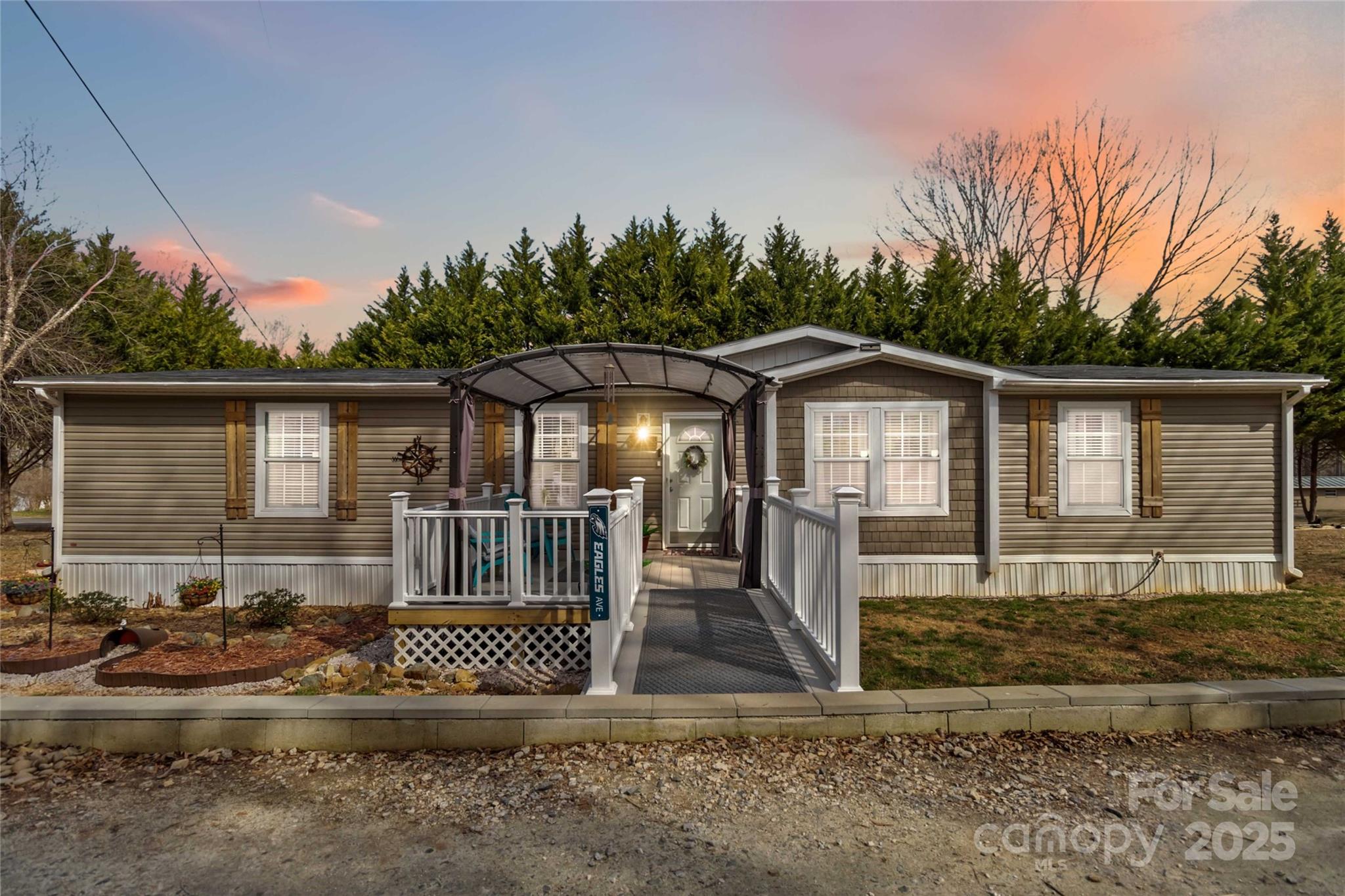 Do not miss out on this gem! As you arrive you are greeted with a beautiful trex deck front porch with an awning that will covey. When entering you have an open floor plan starting with the foyer. To your right is the formal dining and to the left is a spacious family room. The kitchen has an incredible amount of storage including an oversized double sided bar for additional seating for family and guests.  The laundry room has a barn door entry and an exit to the back yard. The master bedroom and bath are amazing. It includes dual vanities, a soaking tub and large walk in shower. The walk in closet is connected to the master bath and you will not believe the size! Both additional bedrooms also have walk in closets providing plenty of storage for the entire family. Don't miss out on this better than new home. Call for an appointment today!