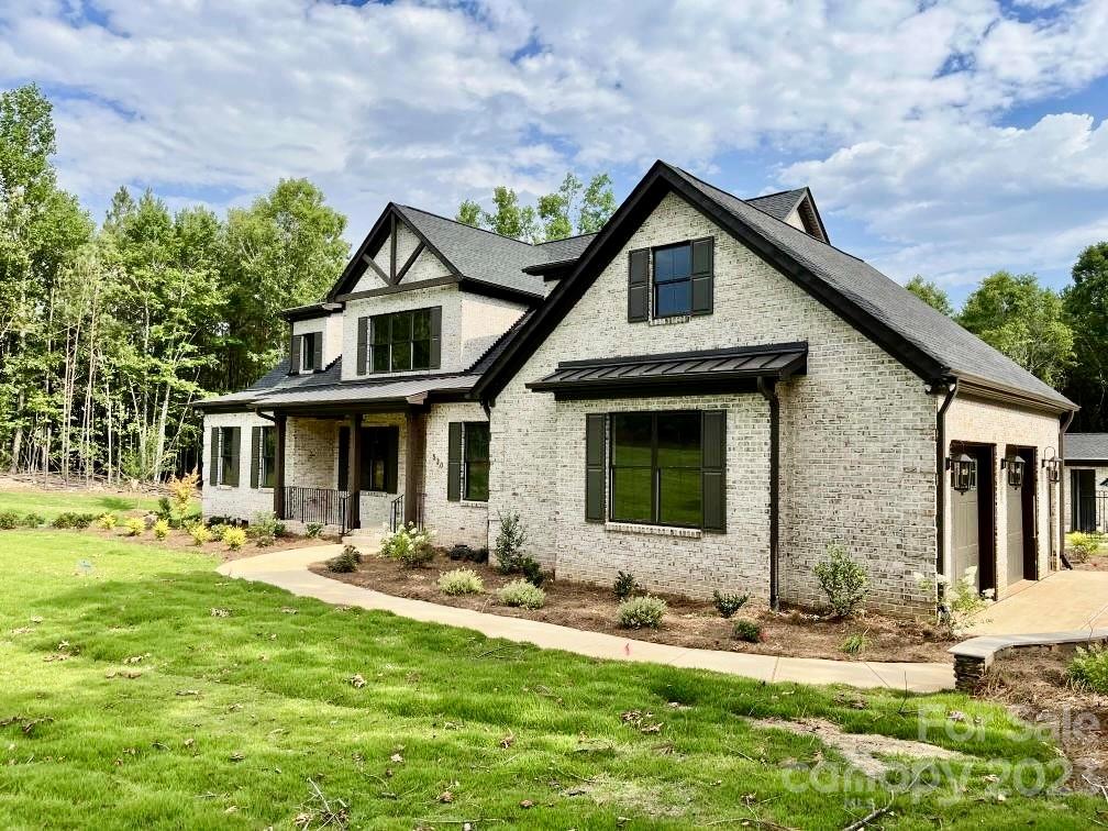 Discover the charm, a truly unique & breathtaking custom-built home situated in the Catawba Shores Estates community. Enjoy upgraded luxury features throughout this stunning home, built in 2022 & move-in ready. This expansive two-story brick home offers versatile living spaces, perfect for both entertaining & everyday living. Boasting 4 beds & 4.5 baths. The primary suite is a haven, featuring an oversized closet & a lavish bathroom w/freestanding soaking tub & tiled shower. The living room invites warmth with a cozy fireplace, while the screened porch provides a tranquil retreat overlooking the picturesque private backyard offering a beautiful heated in-ground pool, pool house, playground, firepit, and grilling area—an ideal setting for relaxation & recreation. Conveniently located just mins from Dave Lyle Blvd & I77 for easy access to shopping, dining & commute to Charlotte or Columbia. If you're searching for a home that offers resort-style living, your journey ends here.