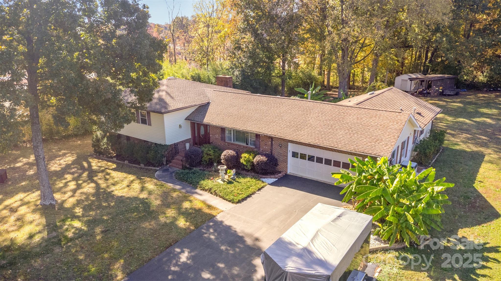 Discover this stunning Huntersville, NC home, boasting a spacious floor plan with 3 bedrooms and 3 full bathrooms on an expansive 4.8-acre lot. The beautifully updated kitchen features a gas cooktop, perfect for culinary enthusiasts. Conveniently located just minutes from I-77, downtown Huntersville, and Birkdale Village shopping, this property offers the ideal blend of privacy and accessibility. Don’t miss this exceptional opportunity! Property is Subdevidable, lot features Vineyard/Fruit Trees.