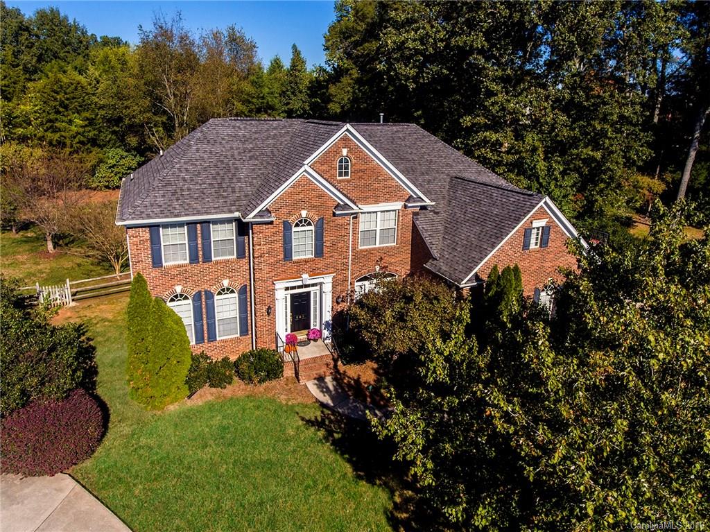 Beautiful Open Floor Plan & Huge Fenced Backyard in Cul-De-Sac! Paver Patio, Irrigation, & Serene Screened-In Porch. 1st Floor Laundry Room w/Sink. Kitchen has White Cabinets, Island, Pantry, Desk, & Granite Countertops. 1st Floor Guest Room, DR, LR, 2 Story Great Room, & Full Bath. Master Retreat Upstairs w/Large His & Hers Walk-In Closets, Double Vanity, Garden Tub & Stall Shower w/Seat. 3 more Bedrooms, Double Vanity Hall BA, & a Bonus Room w/Great Walk-In Storage. Close to Blakeney Shopping!