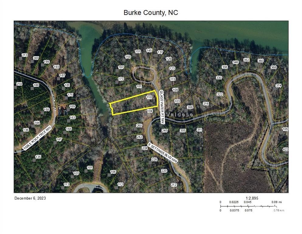 Gorgeous vacant property sitting at 1.14 acres for your dream home to be built with wonderful water views and easy access to the lake. City water and sewer. Gated entrance & Underground utilities. The community has private lake access with dock and boat slips and a large open mountaintop pavilion for barbeques and nice for large family gatherings. Lake Rhodhiss is ideal for fishing, boating, water skiing, wakeboarding, paddleboarding, swimming, kayaking, canoeing, and all water activities! Don't miss this beautiful vacant property this will not last long.