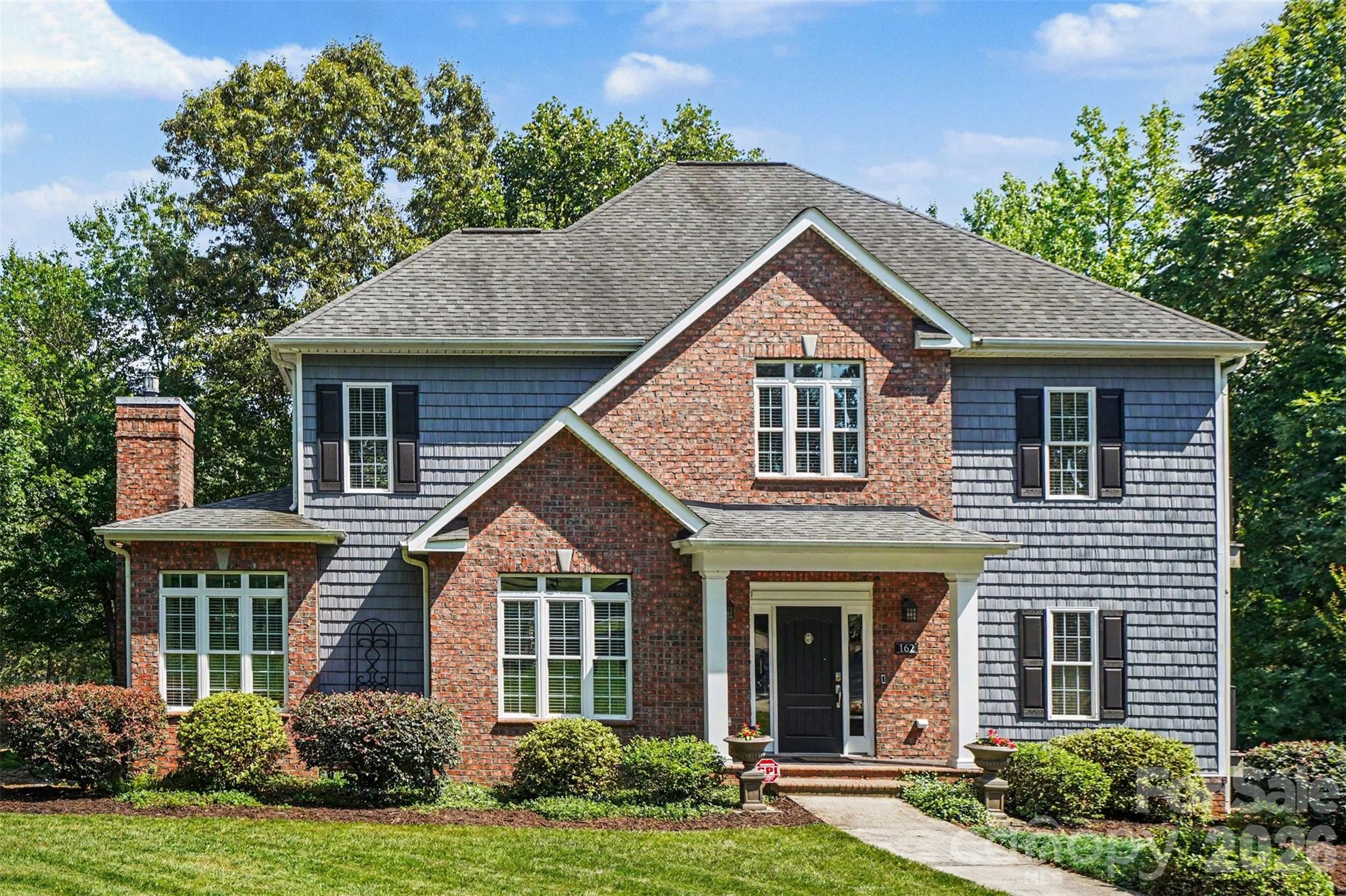 This stunning 3,000-square-foot custom home is nestled on a private 2-acre waterfront lot in a peaceful, sought-after neighborhood—offering the perfect blend of comfort, functionality, and outdoor enjoyment. Start your day on the screened porch with a warm cup of coffee, surrounded by tranquil water views and the soothing sounds of nature. Overlooking a scenic 9-acre pond, this property invites endless outdoor recreation, including paddleboarding, kayaking, and fishing right from your backyard. Inside, the thoughtfully designed layout features three spacious bedrooms and three and a half baths, including two impressive primary suites—ideal for multi-generational living or hosting guests with ease. Amazing 9 foot ceilings throughout the first floor with coffered ceilings in the living room adding a special touch. Flexible living areas provide ample space for both relaxation and productivity, highlighted by a dedicated home office on the main level and a sweet reading retreat on the upper level. Recent upgrades, including luxury vinyl plank flooring and 2 new HVAC systems, ensure modern comfort and peace of mind. The lower level offers a generous workshop area with 10 foot ceilings plus a half bath, perfect for hobbies, storage, or additional workspace. Multiple private terraces extend the living space outdoors, allowing you to take in the serene surroundings from various vantage points throughout the home. This exceptional waterfront retreat truly offers a lifestyle where you can live, work, and play—all in one beautiful setting.
