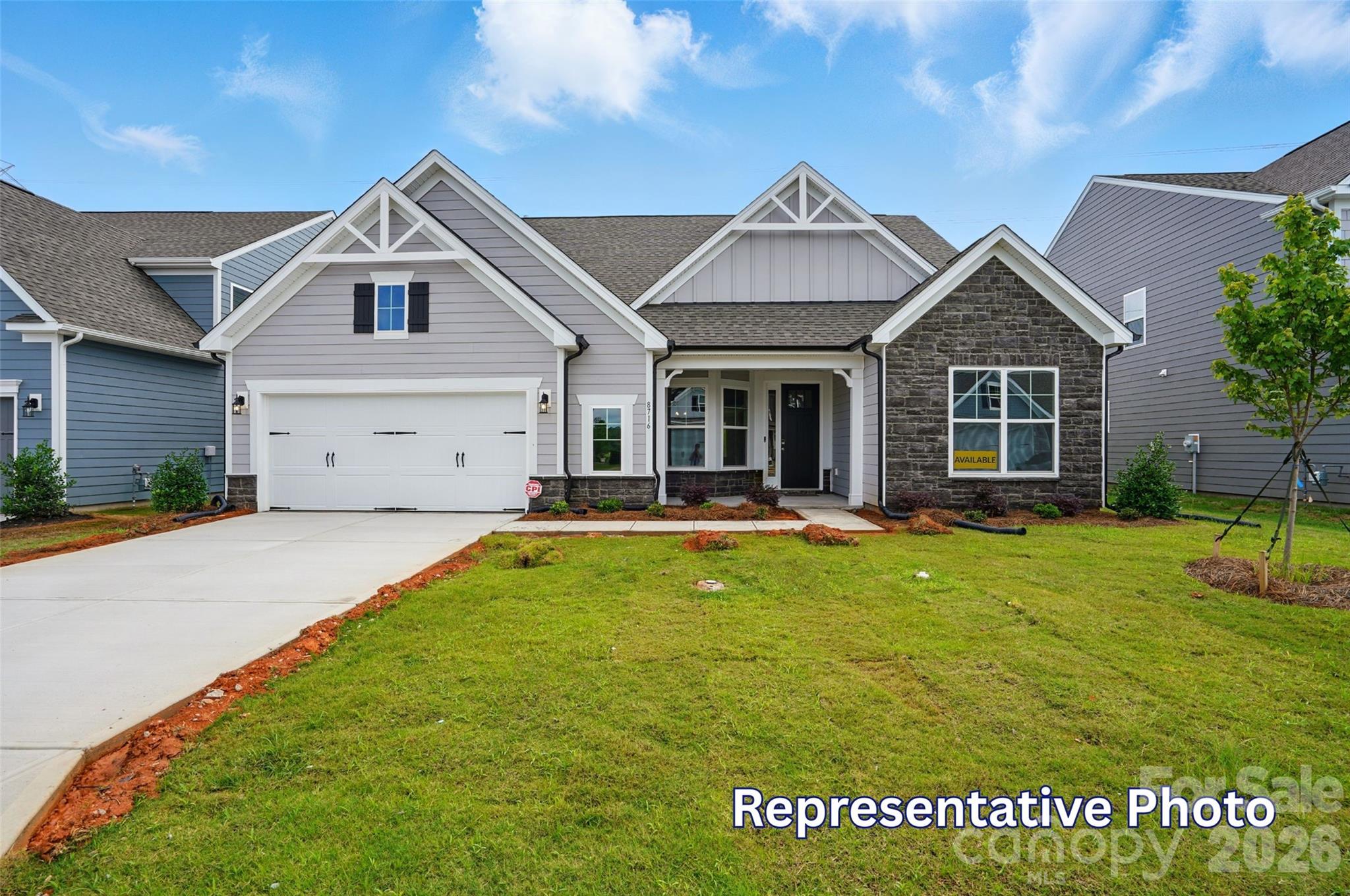 Located in Carrington’s newest phase near Lake Norman, this beautifully designed Edgefield ranch-style home offers over 3,100 square feet with 4 bedrooms and 3.5 baths combining comfort, functionality, and designer finishes throughout. The open-concept central living area features a spacious family room with gas fireplace and marble surround, breakfast area, and upgraded kitchen with white cabinetry, contrasting gray island, quartz countertops, tile backsplash, and stainless-steel appliances. A butler’s pantry with upper and lower cabinetry and quartz counters connects to the elegant dining room with tray ceiling. The private office includes built-in gray cabinetry with white quartz countertops, creating the perfect work-from-home space. The luxurious primary suite features a tray ceiling and spa-inspired bath, featuring the Luxury Shower with tile surround and bench seat, dual vanities with quartz countertops and gray cabinets. On the main level you will also find, two secondary bedrooms, a full bath with tiled shower and bench seat, powder room, laundry room with cabinetry, and mudroom with drop zone. Additional highlights include a spacious loft on the upper level with additional bedroom and bath. Step outside and enjoy your rear screened porch perfect for outdoor living. Community amenities include a pool, cabana, pickleball courts, and playground.