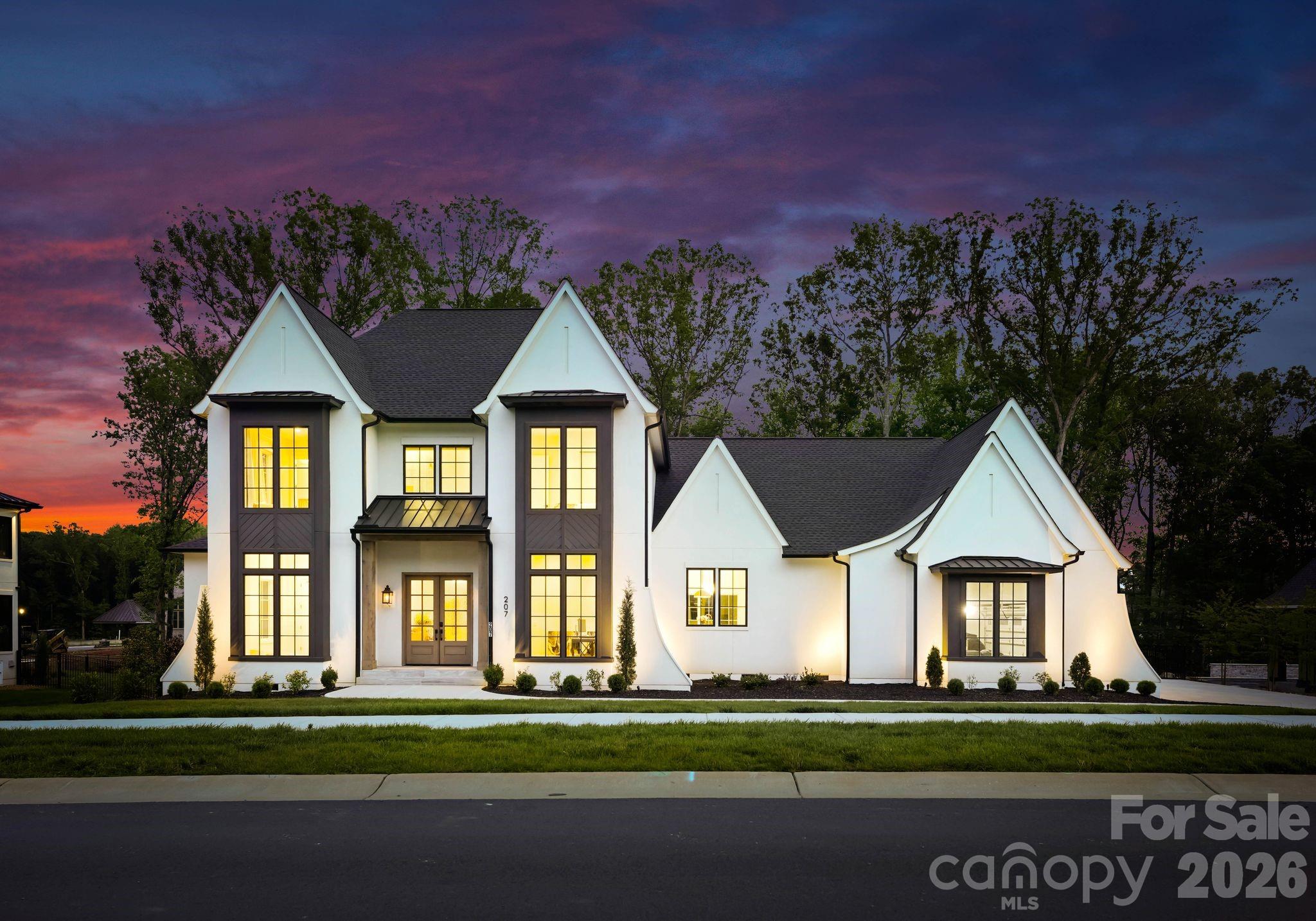 A rare opportunity to own a custom-built masterpiece by PCH Custom Homes in the highly coveted Twin Lakes community. Thoughtfully designed and impeccably crafted, this newly constructed residence showcases one of the most functional and seamless floor plans available in today's luxury market.

From the moment you arrive, the home's exceptional curb appeal commands attention. Professionally curated landscaping, elegant gas lanterns, Italian steps and timeless architectural details create a striking first impression that sets the stage for what lies beyond.

Step inside to discover soaring ceilings, expansive windows, and an abundance of natural light that fills the home with warmth and sophistication. Stunning 7-inch European white oak hardwood flooring flows throughout, creating a cohesive and refined aesthetic.

The dramatic two-story great room serves as the heart of the home, offering an impressive yet inviting space for everyday living and entertaining. A spacious executive office provides the perfect work-from-home setting, while a versatile sitting room across the way can easily function as a main-level guest suite.

The luxurious primary suite is a true retreat, thoughtfully designed with custom California Closets, a spa-inspired bath featuring a marble shower floor, oversized double vanity, and premium rain shower system. The adjoining laundry room combines everyday convenience with elevated design.

The chef's kitchen is nothing short of extraordinary. Anchored by an oversized island, this culinary showpiece features custom soft-close cabinetry, a Sub-Zero refrigerator and freezer, Wolf induction cooktop, double Wolf ovens, dishwasher, touch-activated faucet, Sharp microwave drawer, double farmhouse sink, temperature-controlled wine refrigerator, and an expansive walk-in pantry that is sure to impress.

Surrounded by walls of windows, the dining area offers a bright and airy setting for intimate dinners and large gatherings alike. Just off the three-car garage, an expansive drop zone provides abundant storage along with a custom dog-washing station.

The upper level features three generously sized bedrooms, each with its own private en-suite bath, offering exceptional comfort and privacy for family and guests. Designer lighting throughout the home & curated wooden beams adds an elevated layer of elegance and sophistication.

Outdoor living is equally impressive. Relax on the covered patio featuring a motorized screen, imported Italian tile, Sonos surround sound, and a cozy outdoor fireplace overlooking the fully fenced backyard complete with irrigation. Every detail has been thoughtfully considered, creating a truly turnkey luxury experience.

Residents of Twin Lakes enjoy access to a serene community lake ideal for paddle boarding, kayaking, fishing, and custom pickleball court-embracing an active outdoor lifestyle.

This exceptional custom residence offers the perfect blend of luxury, functionality, and timeless design. Welcome home.