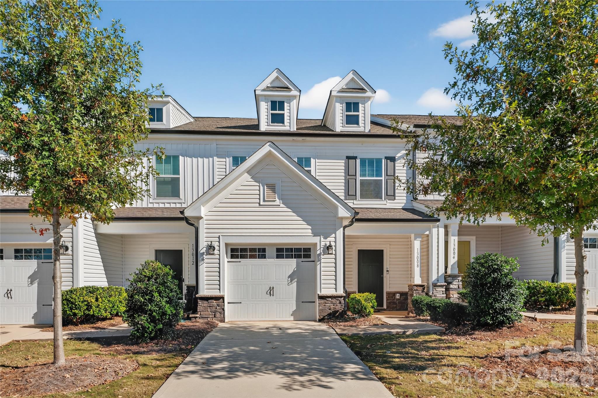 Like-new 2022 townhome offering 3 bedrooms, 2.5 baths, and nearly 1,800 sq. ft. of low-maintenance living with a bright, open layout. The main level features a spacious kitchen with quartz countertops, stainless steel appliances, and modern cabinetry, flowing into the dining area and large great room, making it ideal for entertaining. Upstairs, the private primary suite includes a tiled walk-in shower, along with two additional bedrooms and a convenient second-floor laundry room. A 1-car garage adds everyday convenience, along with outdoor space perfect for relaxing. Prime location with quick access to I-485, shopping, dining, and entertainment, just minutes from the U.S. National Whitewater Center."