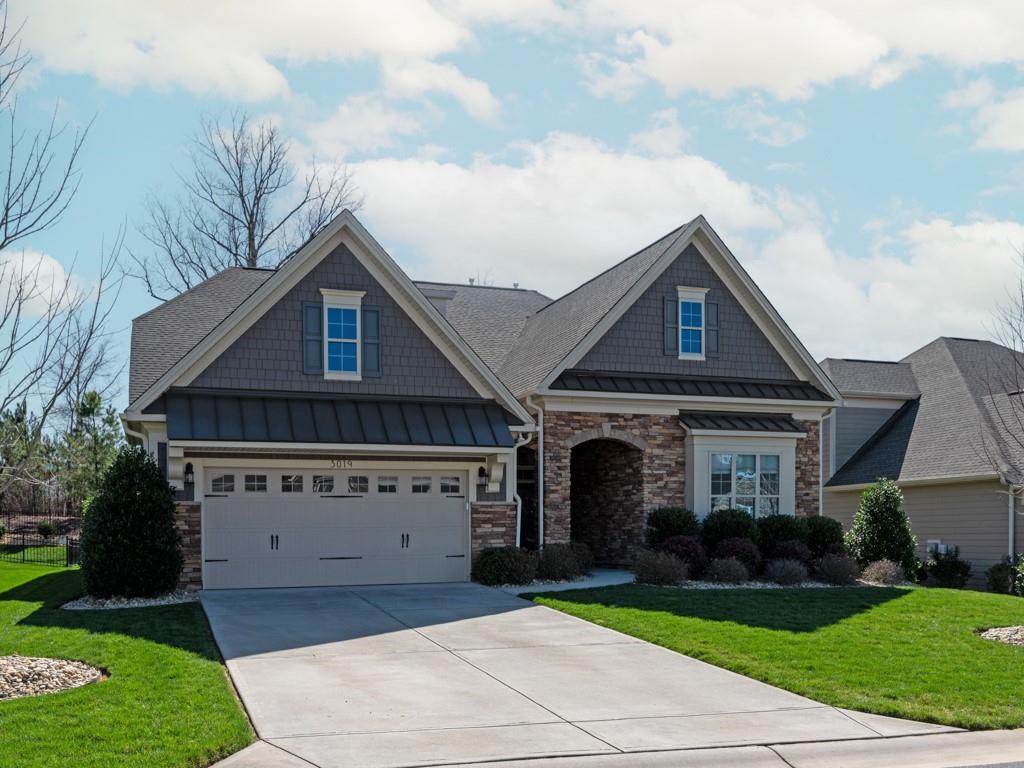 Beautiful, move-in ready home in the desirable Bent Creek neighborhood. Turn key property with an abundance of upgrades and custom features. Open concept great room & gourmet kitchen. Stunning 12 ft ceiling in great room with shiplap electric fireplace and beautiful hardwoods. Chef’s kitchen with custom white cabinetry, oversized island, granite counters, stainless steel appliances, wall oven, 5 burner Wolf range, walk-in pantry & spacious eat in area. Large, airy screened porch overlooking private backyard. 1st floor Primary Suite features spa-like bath with oversized tile shower with dual sink vanity and custom walk-in closet. 2 additional bedrooms on first floor share a full bath. Large custom drop zone located just off garage. Beautiful tread stairs lead to 2nd floor loft and additional bedroom w/full bath and huge walk in storage. Full irrigation, stone & hardboard exterior. Great community amenities to include pool, clubhouse and fitness center.