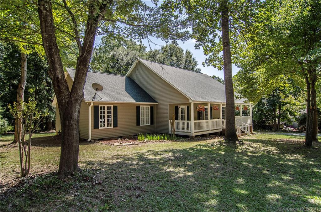 Looking for a roomy home on a large lot with no HOA? Lower South Carolina taxes? Here you go! Quiet and serene yet close to shopping and dining.  This home has a large rocking chair front porch that faces a natural area. The upper level is perfect for the work-from-home office or musician's hide-out. Newer roof, AC and hot water heater. Master down. Screened in back porch and deck faces private back yard.