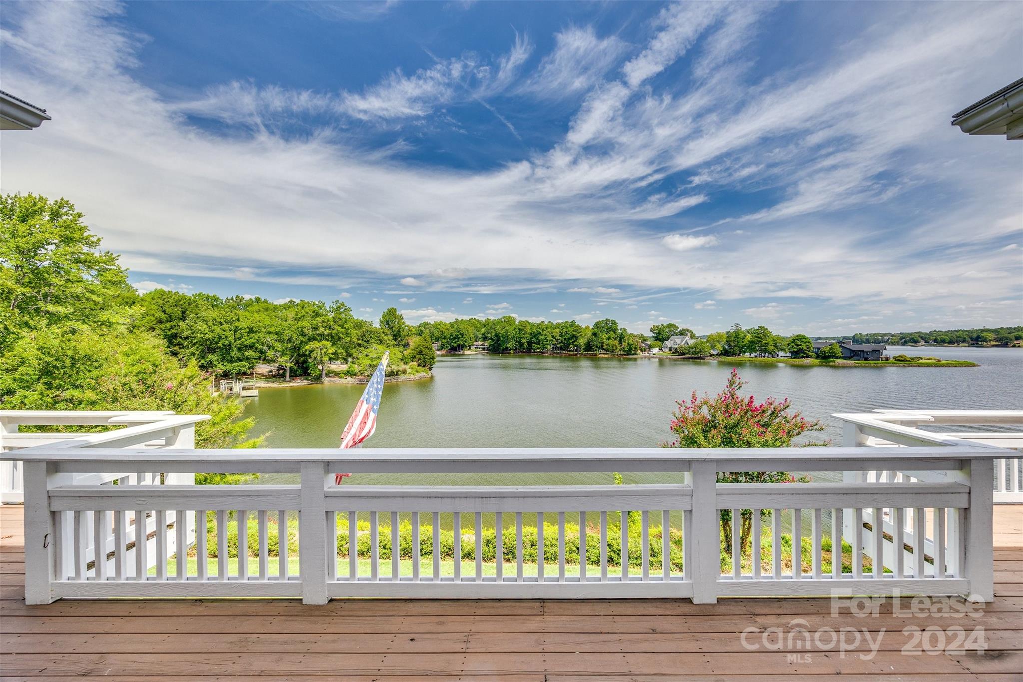 Enjoy breathtaking views at this fabulous waterfront home. It is a resort within a resort. Tucked into almost an acre of privacy in a cove but within view of the main channel, this beautiful home has a wrap-around porch and a sitting area off the boat dock where you can enjoy the outdoors. The kitchen and dining area are fabulous, and the living area also has wonderful views of the lake. The spacious primary suite on the main level has a large closet, a deluxe bath area, and excellent views.  The main level also boasts a separate office and a laundry room. The basement has two bedrooms, two baths, and a large rec room for entertaining.  Oversized two-car garage.
River Hills is a gated community with many amenities, including walking trails, a playground, a dog park, a beach, and a waterfront park. It also has a Marina and a Country Club with an 18-hole championship course. 






It is close to shopping and restaurants and has award-winning schools.