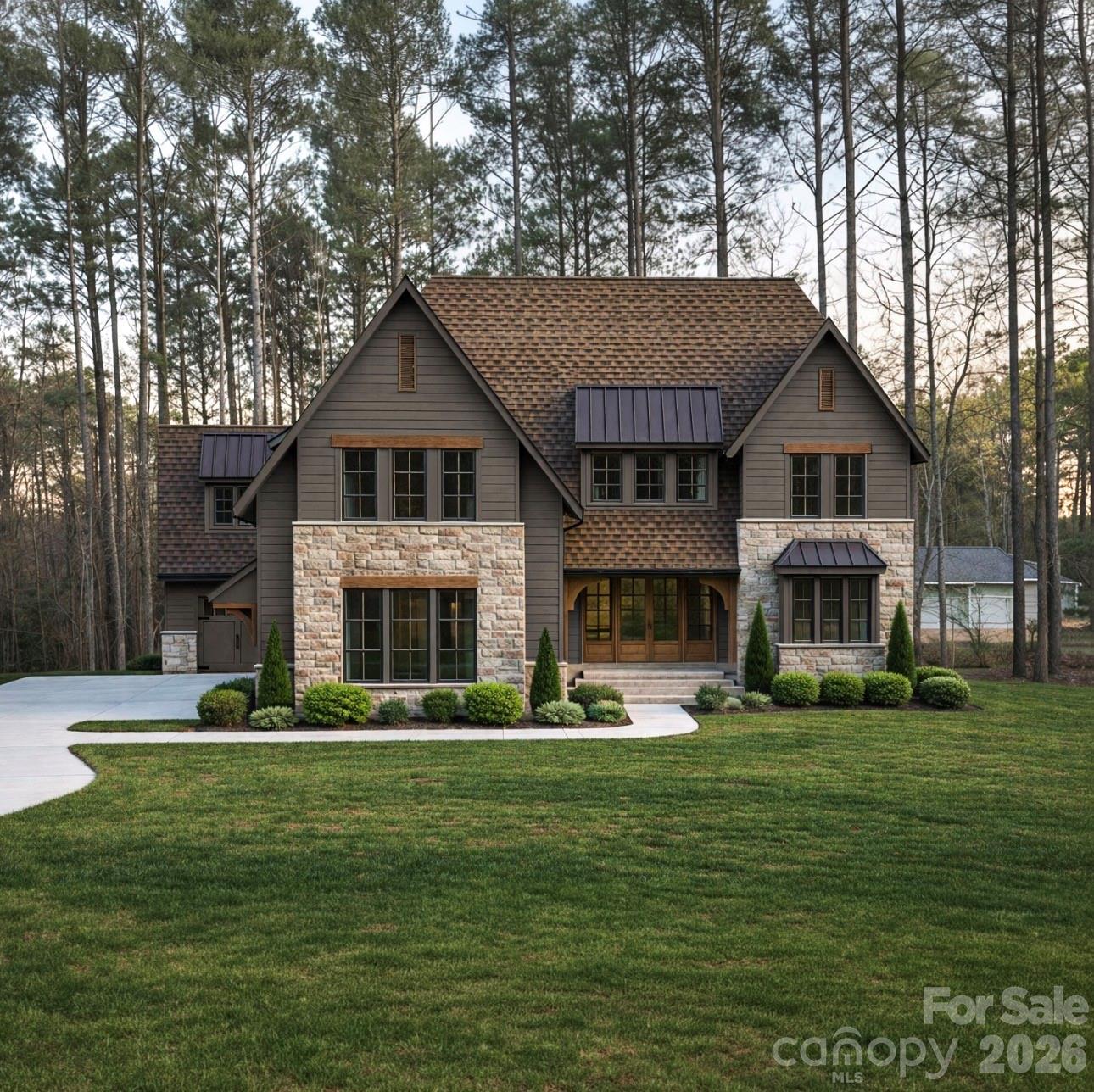 Come live a luxurious lifestyle in this premier Low Country estate, where timeless elegance meets thoughtful design. This signature build, a masterful collaboration between Commonwealth Custom Homes and Bassett Homes, showcases exceptional craftsmanship and attention to detail at every turn.
Every inch of this home has been strategically designed, featuring intricate architectural details and elevated finishes throughout. The dining room and kitchen are highlighted by stunning tray ceilings, while the butler’s pantry is crowned with an elegant groin vault ceiling, adding architectural character and old-world charm. The owner’s suite impresses with a dramatic barrel-vaulted ceiling, creating a true private retreat. In the great room, the fireplace is beautifully framed by arched built-in bookcases, forming a striking focal point that blends warmth with refined sophistication.
Expansive multi-panel sliding glass doors open from the great room to a spacious screened porch, flooding the interior with natural light and seamlessly blending indoor and outdoor living. This inviting space is perfectly designed to capture scenic views, making it ideal for entertaining or relaxing while enjoying the surrounding landscape.
The owner’s suite on the main level offers ultimate convenience, complete with its own washer and dryer. Also on the main level is an additional bedroom with a full bath—perfect for guests or easily adaptable as a private office. A well-appointed scullery seamlessly connects to the mudroom and laundry, enhancing both function and flow.
Upstairs, you’ll find a spacious media room, three additional bedrooms, and flexible office space, along with an additional laundry room for added convenience.
This home is the perfect blend of luxury, comfort, and intelligent design—crafted for those who appreciate refined living at its finest.