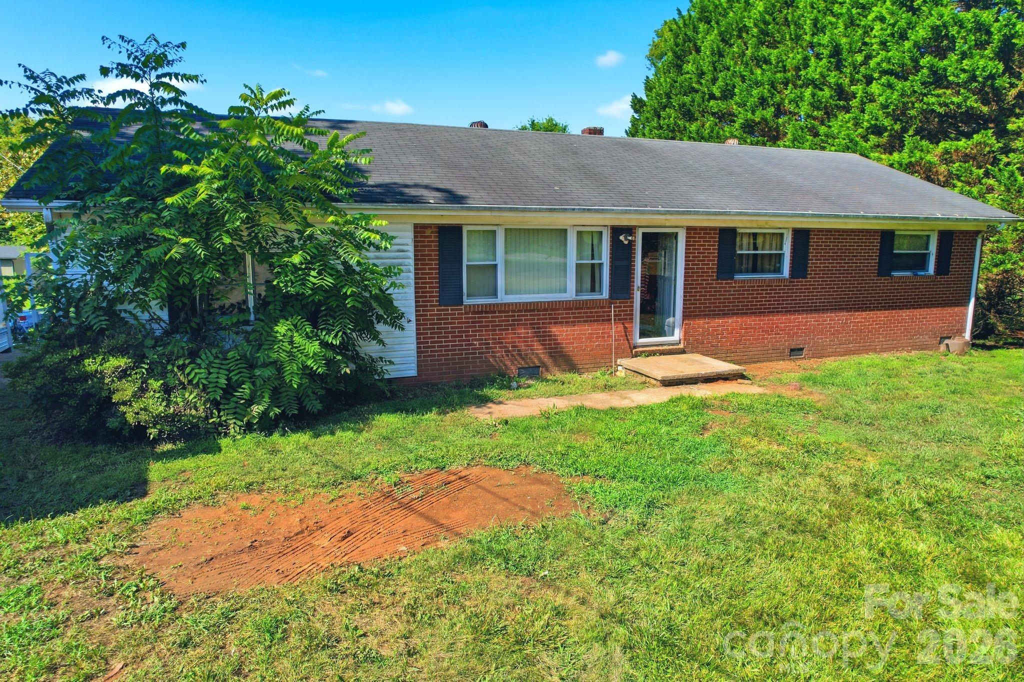Handyman special!!! Fix and flip, fix and rent, or put in the sweat equity for your primary residence. Country location but close to Statesville amenities and N. Iredell. Featuring a brick exterior, oversized level lot,  and huge concrete block building with a drive-in opening for a covered parking space. Less than 5 minutes to the new Jennings Park with pickleball courts, walking trails, a playground, baseball and soccer fields. Short commute to I-77 and I-40. Heat pump replaced in 2014. Lots of possibilities with this. VA renovation loan, cash, 1031 exchange, or conventional loan only. Being sold "as-is". Please submit your highest & best offer by 5:00 pm Monday, July 20.