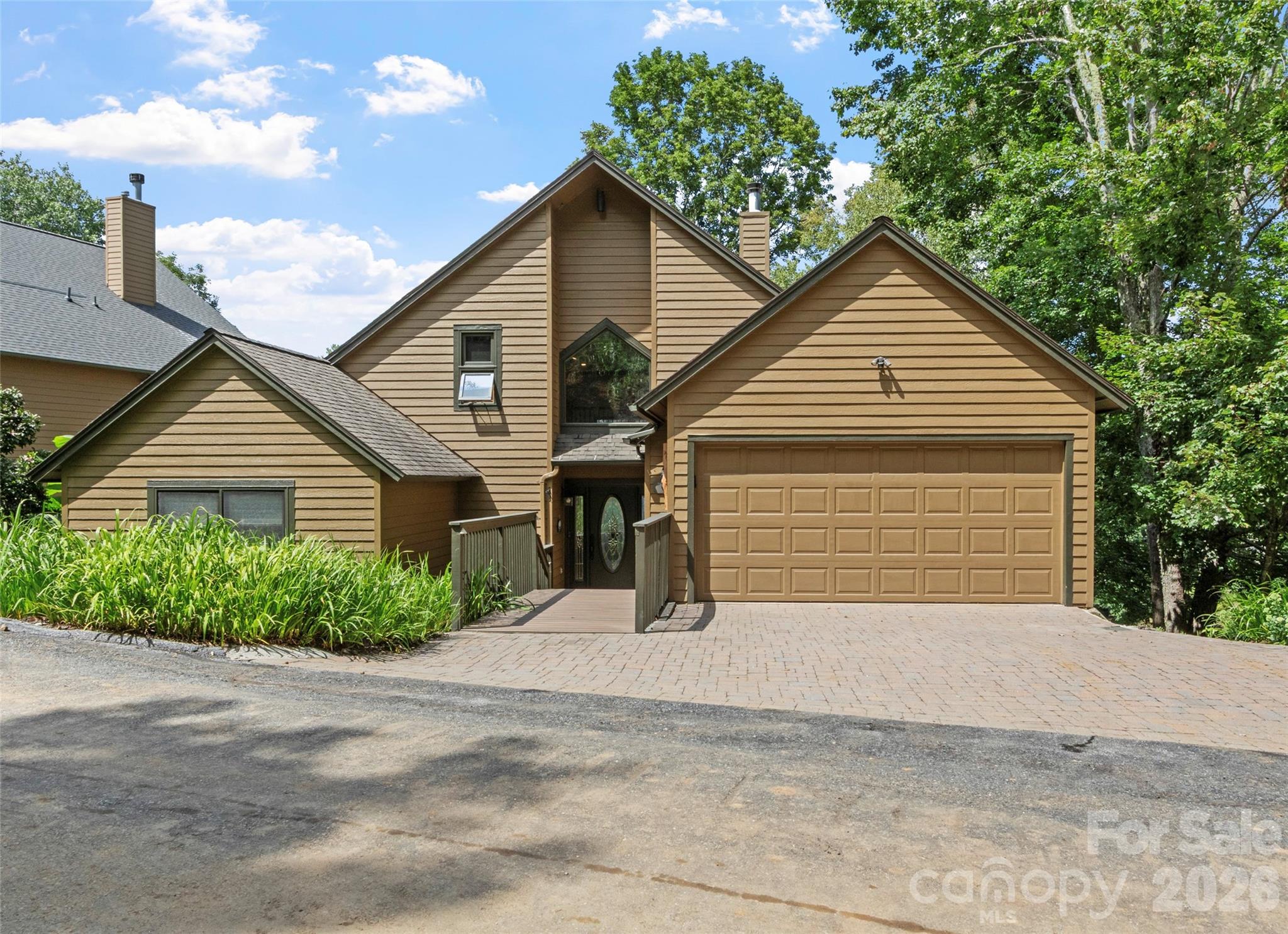 Nestled in the sought-after Brandy Run neighborhood of MOUNTAIN AIR Country Club, this beautifully maintained 4-bedroom, 5-bath home offers approximately 3,000 square feet of peaceful mountain living. Enjoy fabulous long-range views and a prime vantage point overlooking the pristine fairway of hole #17. The main level is designed for comfortable, open-concept living, featuring rich hardwood floors, expansive windows that flood the space with natural light, and direct access to a spacious new Trex deck—perfect for soaking in the scenery. The primary suite on this level is a private retreat, complete with stunning view windows, deck access, and a well-appointed en suite bath with double vanity and a walk-in tile shower. A second bedroom or office and a full hall bath add flexibility and convenience. The kitchen is thoughtfully designed with ample cabinetry, a pantry, and seamless flow into the dining area and great room—ideal for entertaining or everyday living. Upstairs, a versatile loft provides additional space for a den, office, or sleeping area. The lower level expands the home’s living space with two generously sized guest suites and an oversized family room featuring a striking stone fireplace, wet bar, and access to a second view deck—perfect for hosting or relaxing. Additional highlights include an attached garage with room for a vehicle, golf cart, and extra storage. The home is offered unfurnished, providing a blank canvas for your personal style. Ideally located near Mountain Air’s exceptional amenities—golf, tennis, pickleball, wellness center, spa, dining, and more, available with a separate club membership. This property also grants access to over 6 miles of hiking trails, seven parks (including a dog park), and a private mountaintop runway.