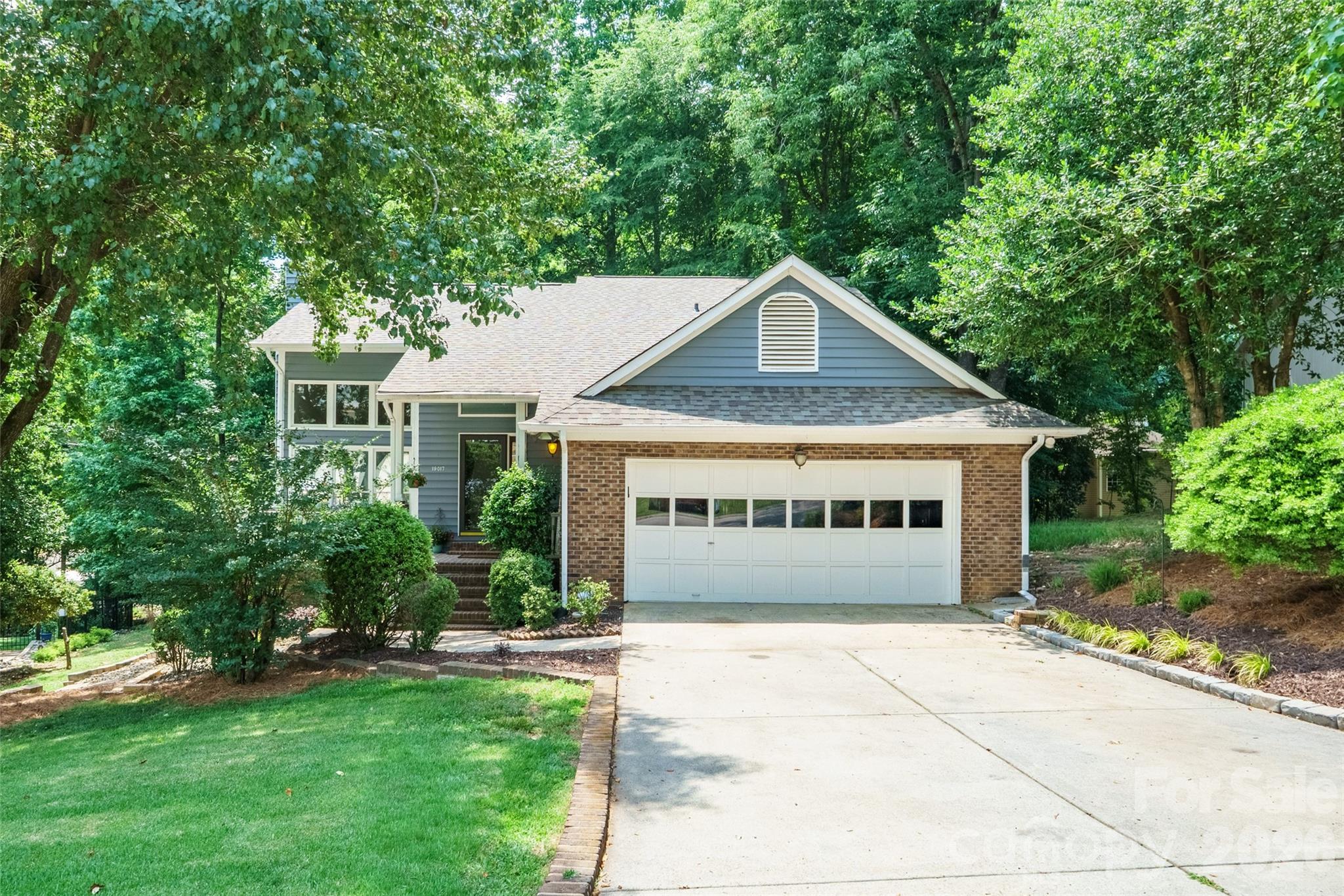 Welcome home to this exquisite 4-bedroom, 3.5-bath property with a fully finished private walk-out basement in highly sought-after Tega Cay, SC golf community with friendly neighbors! Minutes from the Lake Wylie marina and the beloved Windjammer Park featuring its own beach, playgrounds, paddle boating, fishing, pavilions, and more.  This property and community are a must see.

This beautifully maintained home offers a bright, open interior filled with natural light and a neutral color palette throughout. The spacious great room features a stunning stone gas fireplace, creating the perfect place to relax or entertain.

The updated kitchen shines with an eye-catching backsplash and appliances, while the private primary suite offers a spacious walk-in closet and ensuite bath. Additional upstairs bedrooms provide flexible space for guests, a home office, den, or hobbies. The large family/bonus room at the back of the home is filled with gorgeous natural light from oversized windows and offers even more room to gather and unwind.

Step outside to the sprawling back deck, with covered pergola and fenced backyard, perfect for entertaining or enjoying peaceful evenings surrounded by nature. With ample indoor and outdoor storage plus an unbeatable location, this home is the perfect blend of comfort, style, and functionality.
Roof replaced in July 2023, upstairs HVAC unit July 2024, crawl space redone with vapor barrier and replaced insulation in July 2023.