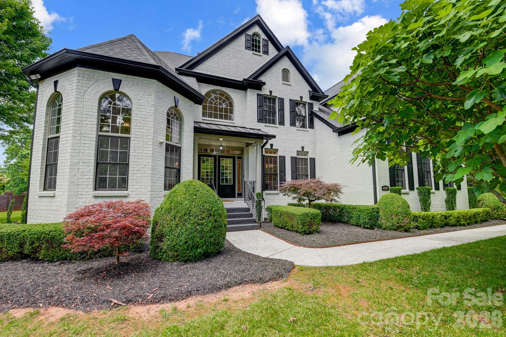 Perfectly positioned in one of Charlotte’s most sought-after enclaves, this exceptional residence offers a seamless blend of contemporary luxury and timeless sophistication just moments from top-rated schools, premier golf courses, scenic greenways, SouthPark Mall, and Uptown Charlotte. Designed for both elevated living and effortless entertaining, the home features four spacious bedrooms and four beautifully appointed baths, with an open-concept layout filled with natural light, gleaming hardwood floors, and curated designer finishes throughout. The gourmet chef’s kitchen serves as the heart of the home, showcasing premium stainless steel appliances, granite countertops, custom cabinetry, and an expansive center island ideal for gatherings large or small. The primary suite is a true private retreat, complete with a spa-inspired ensuite bath and generous closet space. Outdoors, meticulously landscaped grounds provide a serene setting perfect for quiet mornings or summer entertaining. A new roof installed in 2025 offers added peace of mind and long-term value, making this a rare opportunity to enjoy refined luxury, exceptional convenience, and the elevated lifestyle today’s most discerning buyers expect.
