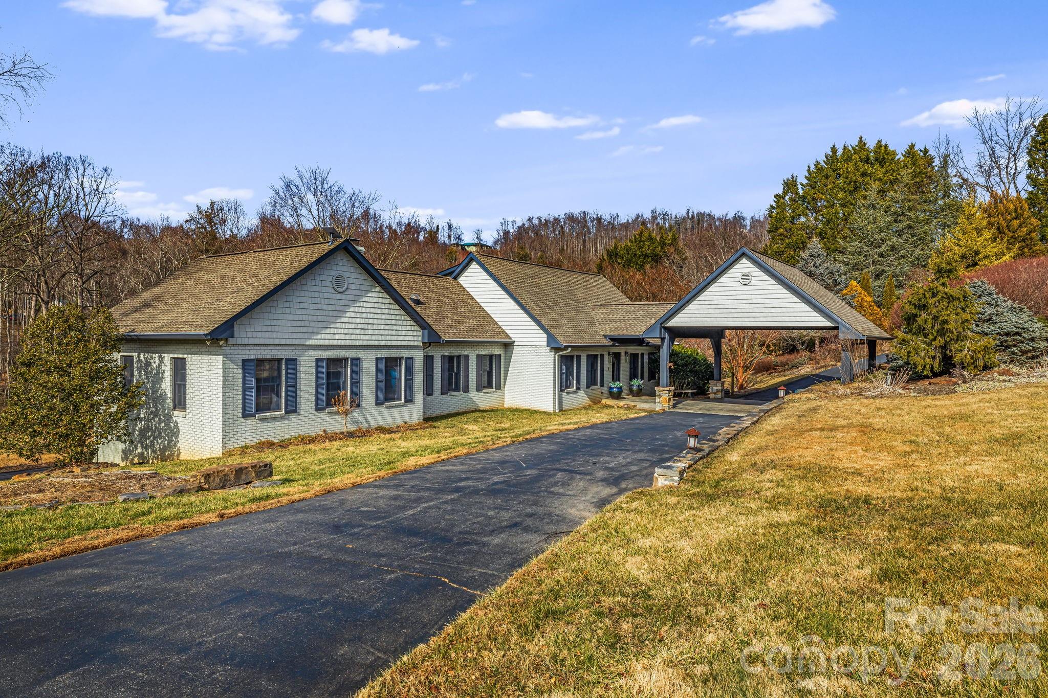 Set on approximately 4.6 acres of private mountain land, this Fairview retreat delivers a rare combination of space, privacy, and income-producing versatility just outside Asheville. The 3,343 sq ft main residence anchors the property with four bedrooms, multiple gathering areas, a double-sided electric fireplace, a well-equipped kitchen, and a dedicated lower-level game room ideal for entertaining and extended stays. A fully detached guest house of around 780 sq ft HLA enhances the offering with two additional bedrooms, its own kitchen and living space, private laundry, hot tub, fire pit, and deck—creating a true multi-structure layout well suited for diversified short-term rental use. Outdoor living is a highlight, featuring a seasonal pool, open lawn areas, and wooded surroundings that provide a sense of seclusion while remaining accessible. With strong rental appeal, flexible occupancy, and amenity-rich design, this property presents an exceptional opportunity as a high-performing STR or private mountain compound. Property includes two separate residences. 1236 Upper Brush Creek offers three bedrooms above grade plus one additional bonus room below grade. 1234 Upper Brush Creek includes two additional bonus rooms. Seller is in the process of expanding the existing permit from three bedrooms to five.