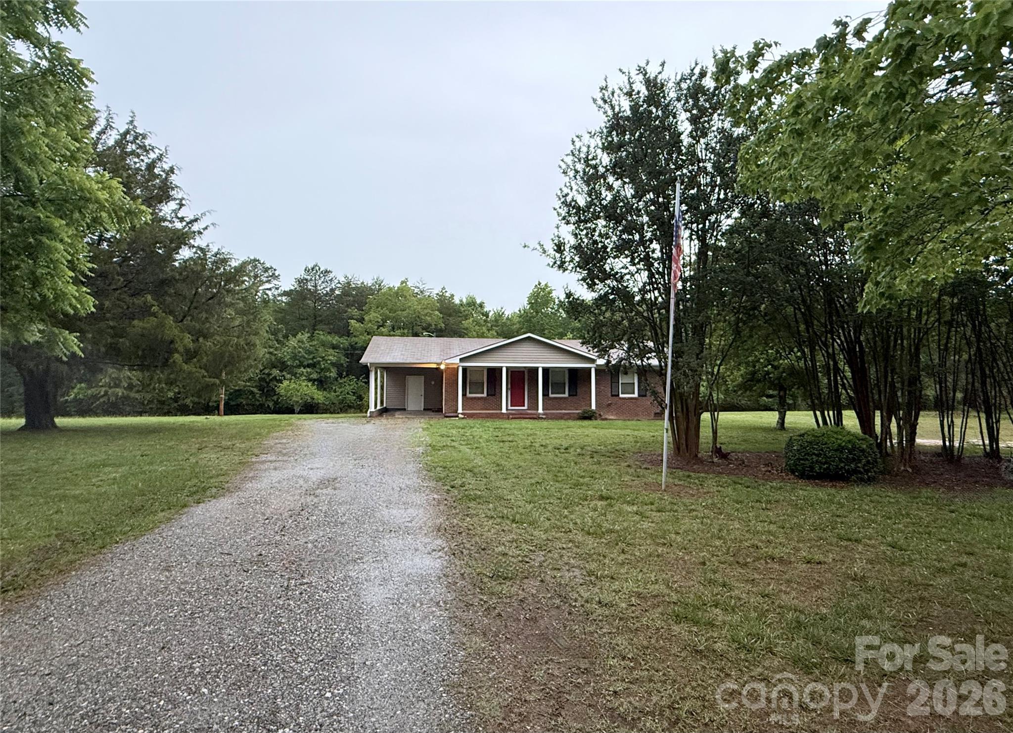 A rare opportunity to own a move in ready brick ranch home nestled on a spacious 1.25+/- acres level lot in the prime Pumpkin Center/North Lincoln Denver Location. Home has been freshly painted with new flooring installed. A commuter’s dream with Hwy 16 Access in under 5 minutes, Uptown Charlotte 30-35 minutes, Charlotte Airport 30 minutes, Huntersville 20 minutes, and Mooresville  25-30 minutes via NC-150. Your own peaceful acreage with no HOA and no City Taxes. An incredible opportunity to claim your own rural acreage without sacrificing a fast commute.