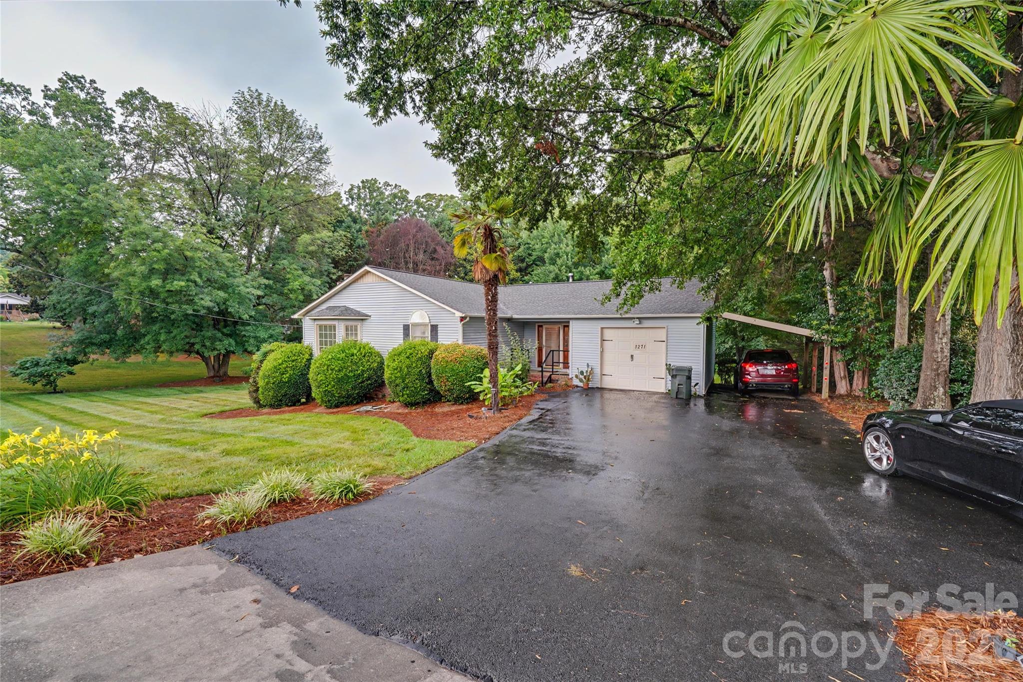 Discover the perfect blend of comfort, flexibility, and outdoor living at this beautifully maintained home situated on a picturesque .72-acre lot. Surrounded by mature landscaping and a spacious backyard, this property offers the peaceful setting you've been looking for without sacrificing the convenience of city amenities.

The thoughtfully designed main level features two spacious bedrooms and inviting living spaces filled with natural light. Downstairs, the finished walkout basement creates endless possibilities with a third bedroom, full bathroom, and an additional family room—ideal for a guest suite, private in-law retreat, home office, or recreation space. The basement bedroom opens directly onto a covered patio, creating a peaceful retreat to relax and enjoy the backyard.

Outdoor living is a standout feature of this home. The expansive deck overlooks the beautifully landscaped backyard, providing the perfect setting for morning coffee, outdoor dining, or entertaining family and friends. With nearly three-quarters of an acre, you'll have plenty of room for gardening, pets, play, or simply enjoying the privacy and beauty of your own outdoor oasis.

Ideally located on India Hook Road, you'll enjoy convenient access to Downtown Rock Hill, Winthrop University, Piedmont Medical Center, I-77, shopping, dining, parks, and everyday conveniences—making it easy to enjoy everything the area has to offer.

To help make this home your own, the seller is offering a credit toward new carpet with an acceptable offer, giving buyers the opportunity to choose flooring that matches their personal style.

Offering flexible living spaces, an exceptional outdoor setting, and a highly desirable location, this home presents a wonderful opportunity to enjoy the best of Rock Hill living. Schedule your private showing today!
