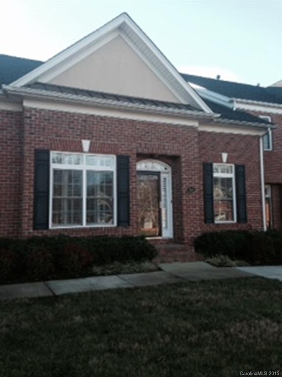 Beautiful 2 bed, 2 full bath all brick town home walking distance to shopping, restaurants, movies, medical & hwy 77.  Open spacious floor plan, high ceilings, neutral decor. Kitchen w/ granite counters.  Master w/ large bath, tile, whirlpool, cultured marble, huge shower.  2nd bed on main w/large bath.  Loft room w/ large walk in closet & walk in attic space.  Large dining room area, family w/ fireplace. Plantation shutters in all windows. Private court yard w/ gate for security.  2 car garage.