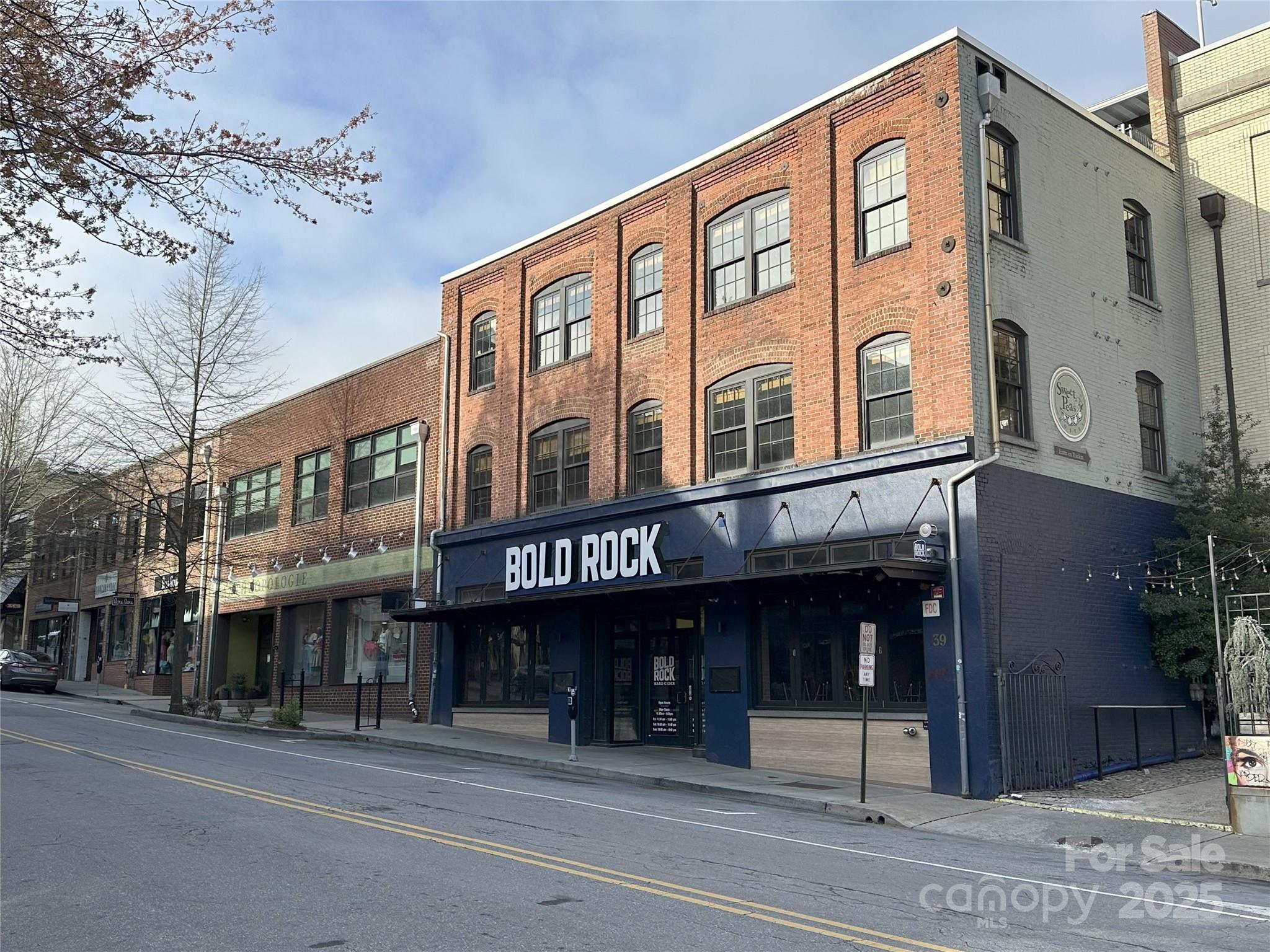 Fully Equipped Brewery / Restaurant Available NOW!!!!: The retail condo at 39 N. Lexington Avenue in Asheville, NC, offers a unique opportunity for a new owner seeking a versatile commercial property in the heart of downtown. Constructed in 1916, this historic building features a brick facade and has housed various businesses over the years, including the Oscar Blues Brewery and Bold Rock Hard Cider/Taproom. Given its prime location and adaptable space, 39 N. Lexington Avenue presents an excellent opportunity for businesses seeking a prominent
downtown presence. The space is set up as a full Brewery with a 15 Barrel Brewhouse and a fully equipped restaurant / bar / commercial kitchen. The space features 7,000 square feet of retail space and 1,000 square feet of dry/cold storage on the second floor off Rankin Ave. 39 N. Lexington is situated in the heartbeat of Downtown Asheville and benefits from the city’s reputation as a hot spot for tourism.  Owner is willing to entertain conversations around a Lease / Purchase / Option scenario for the right credit tenant / buyer.