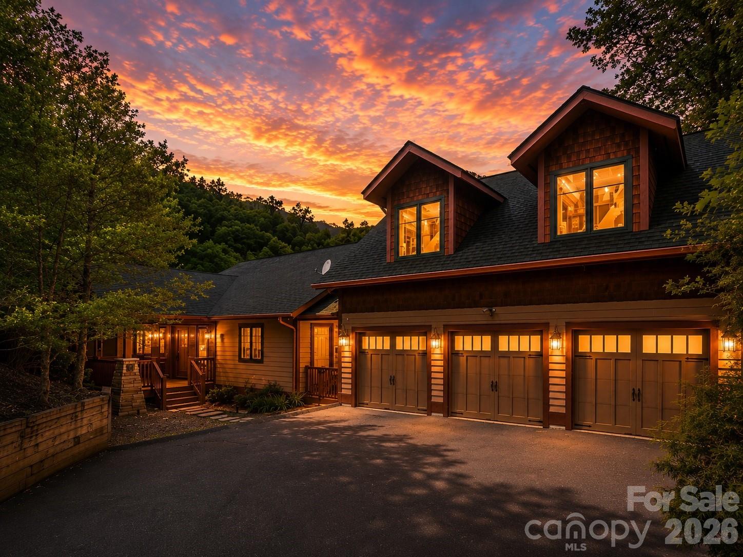 Perched inside the gated mountain community of Laurel Ridge just outside Black Mountain, this fully furnished retreat captures the mountain lifestyle buyers come here searching for. Wake up to long-range views from the deck, spend evenings in the hot tub beneath cool Carolina skies, and gather around the fireplace after days exploring nearby trails, breweries, and downtown Black Mountain.
Designed for both connection and comfort, the home features open living spaces, expansive decking, and warm mountain-inspired finishes throughout. A separate apartment offers added flexibility for guests, multigenerational living, or rental potential, while the theater and game room create the perfect setting for unforgettable weekends and repeat stays.
Whether envisioned as a private escape, income-producing property, or both, this home offers the rare combination of views, privacy, entertainment space, and flexibility in one of the area’s sought-after gated communities.