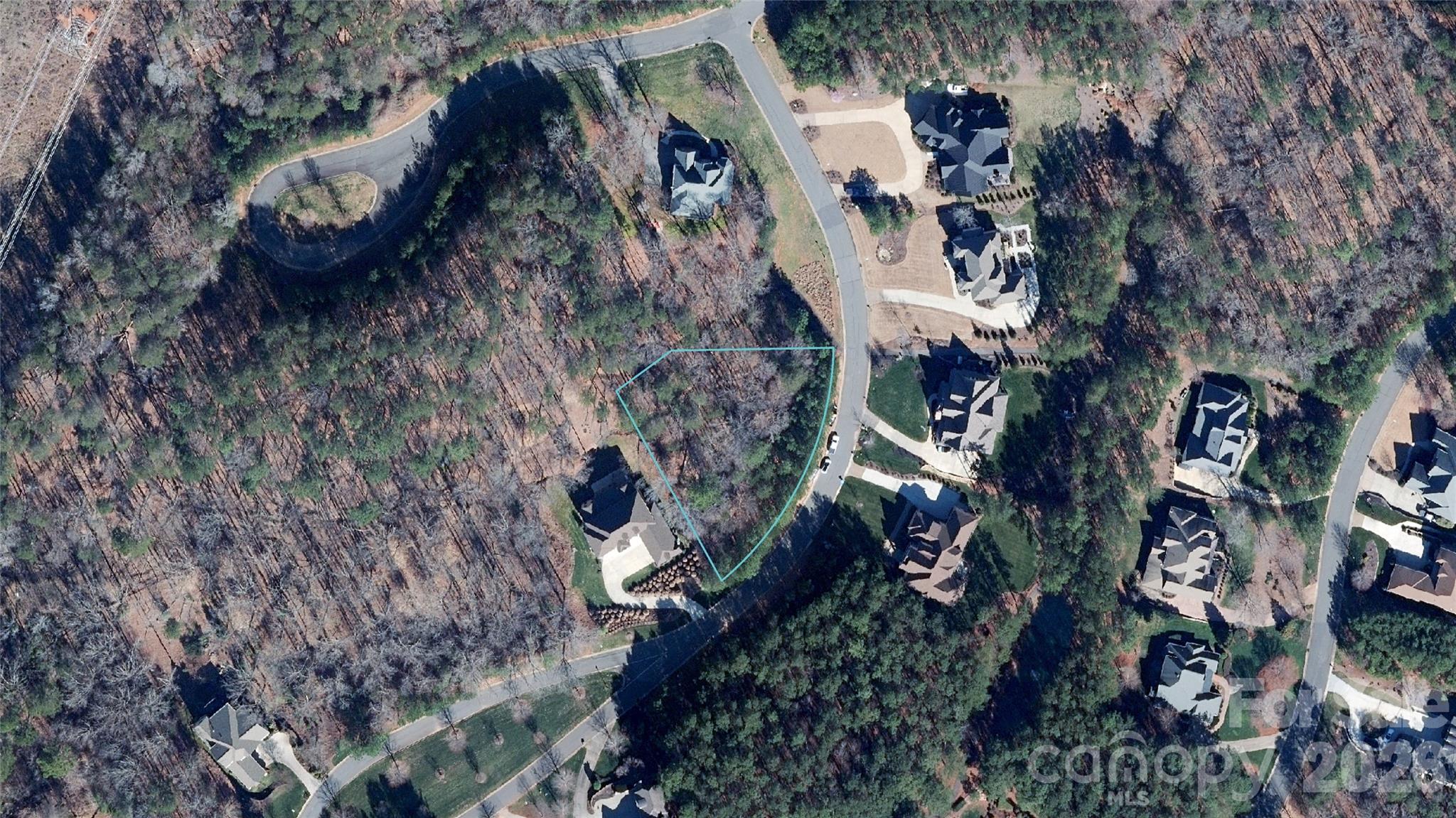 Experience the pinnacle of custom living on this premier .66-acre homesite, perfectly positioned deep within the exclusive gated community of Reflection Pointe. This exceptional lot offers seasonal water views of Lake Wylie and features a sloped topography ideal for a custom walk-out basement or crawl space foundation. Rare privacy is built-in, as the property borders community greenspace on both the rear and side, providing a natural buffer and a scenic path leading directly to the clubhouse. As a true custom-home community, Reflection Pointe allows you to work with a featured builder or your own to meet the high standards of the neighborhood (minimums of 2,000 sq. ft. for 1-story and 2,400 sq. ft. for 2-story homes). Residents enjoy resort-style amenities including a waterfront pavilion, community beach, marina area, boat storage, pool, and tennis/pickleball courts. While there is no immediate timeframe to start your build, the community ensures a high-quality environment with a 12-month completion window once plans are approved. Located just 20 minutes from Charlotte Douglas International Airport and 30 minutes from Uptown Charlotte, you can enjoy the quiet, small-town charm of Belmont’s restaurants and breweries while remaining connected to the city. If you are ready to build your dream home, this unique lakeside opportunity is a must-see.