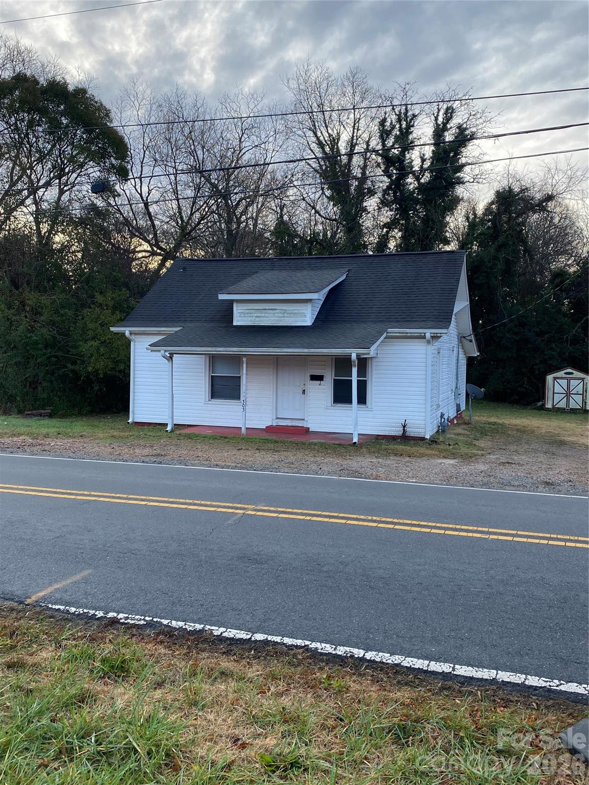 Charming 3-bedroom home just 5 minutes from downtown Kannapolis. This property offers a comfortable layout with living area, kitchen, and a dining room that can double as a flex space to fit your needs. Laundry is conveniently located inside the home. No stairs coming in front.

Enjoy mornings on the covered front porch, and take advantage of the storage building out back for tools, hobbies, or extra space. One bedroom is accessed through another, making it ideal for a nursery, office, or private suite setup.

Recent updates include new HVAC and new carpet installed prior to the current tenant.

A great opportunity close to shopping, dining, and all that revitalized Kannapolis has to offer.

Home is TENANT occupied please DO NOT DISTURB TENANT
