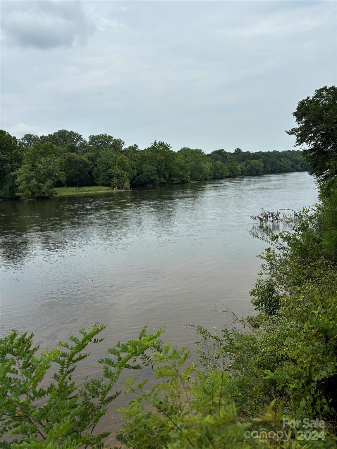 WATERFRONT on the shores of the Catawba River!  Are you looking for a quiet relaxing place to cool off and enjoy the river?  If so, this lot is for you!!  Build your dream home or secondary home. Boat, ski and Fish 
VACATION RENTAL opportunity
Mainly level wooded lot in River Rock Shores Subdivision. HOA dues are optional, community features river access, park and amenities. If paid dues, you can use park and amenities. Boat ramp use is included in deed.
Lot is in an AE Flood zone: Flood insurance;    Home would need to be on a pier or raised foundation,  
Lot is staked for boundary lines

Convenient access to I40 - short distance from Catawba, Statesville and Hickory