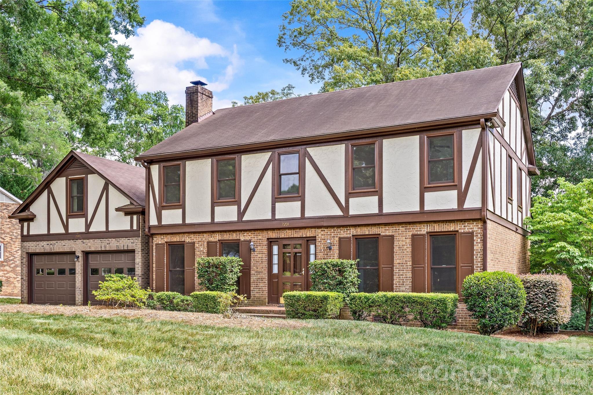 Welcome to your opportunity in the heart of Quail Hollow Estates, one of Charlotte's most established and sought-after neighborhoods. This charming tutor home is situated on a beautiful, serene lot.  This four-bedroom, two-and-a-half-bath home offers timeless appeal, a functional floor plan, and endless potential to create the home you've always envisioned. The main level features spacious living areas, a two-car garage, and a screened porch overlooking a private, beautifully landscaped backyard—an ideal setting for relaxing, entertaining, or simply enjoying the peaceful surroundings. Upstairs, the generous primary suite includes a private ensuite bath, while a large bonus room provides exceptional flexibility as a media room, playroom, executive office, fitness studio, or additional living space. The location offers an unbeatable lifestyle, just minutes from Quail Corners Shopping Center, Whole Foods, SouthPark, and Phillips Place, with some of Charlotte's finest dining, shopping, and everyday conveniences close at hand. As an added bonus, residents enjoy private neighborhood access to the Little Sugar Creek Greenway, connecting you to miles of scenic walking, running, and biking trails. Built in 1978, this home is the perfect canvas for your personal vision. Even better, much of the heavy lifting has already been completed. The property has recently undergone extensive structural repairs and other significant improvements, providing peace of mind and a strong foundation for future renovations. Complete documentation of the completed work is available for buyer review. Whether you're looking to thoughtfully update over time or embark on a full renovation, the combination of an exceptional lot, desirable neighborhood, and completed structural improvements creates a rare opportunity to build lasting value in one of Charlotte's premier locations. Some listing photos have been digitally enhanced using AI to illustrate renovation possibilities. Original, unaltered photos are also included in the listing.  New foundation stabilization and repair with warranty (2026), transferable Terminix contract (2026), new microwave (2024), complete whole-home window replacement by Renewal by Andersen (2023), custom back step handrails (2021), new high-efficiency HVAC heat pump (2020), modernized kitchen cabinets with new doors/drawers (2020), new garage doors (2019), and routine professional landscaping with a custom retaining wall. 493 square foot bonus room is heated and cooled by mini split system and is not included in the homes total heated and cooled area.