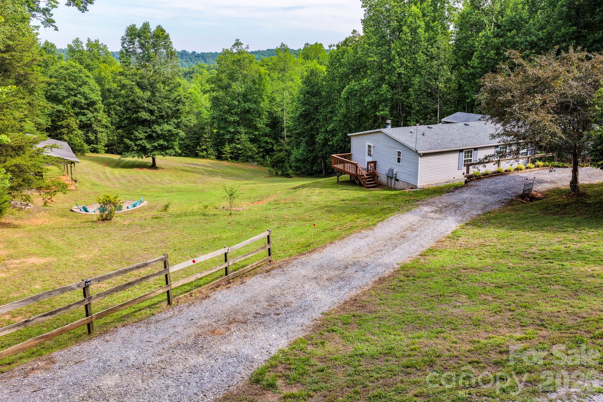 LAKE LURE.....4 bedrooms, 2 1/2 bath.....2050 sq ft, manufactured home on 3.5 acres of great laying land with a barn and just minutes from beautiful Lake Lure. Great starter home or short-term rental opportunity. Priced right at $309,500.