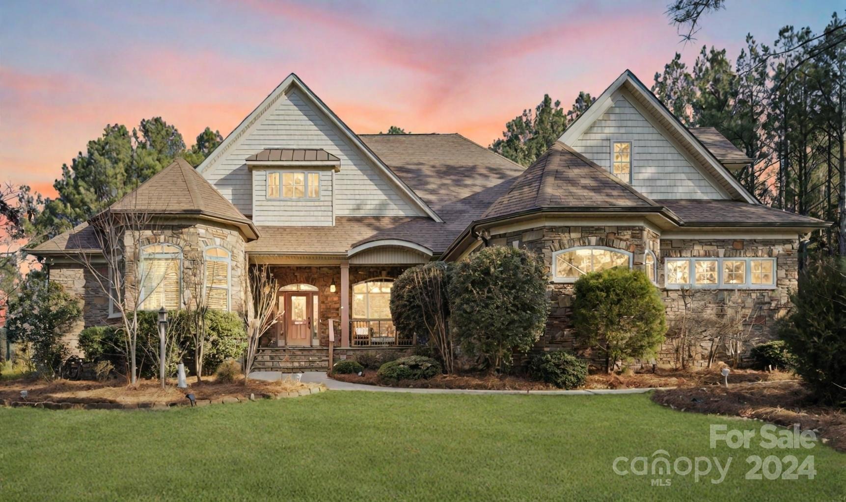 Nestled within the picturesque Catawba Shores Estates, this stately custom brick and stone home epitomizes luxurious living on over an acre of private lot. Boasting an open floor plan, exquisite craftsmanship, and an array of desirable amenities for discerning buyers. Step inside to discover an expansive interior adorned with upscale finishes and meticulous attention to detail.The main level features three spacious bedrooms and three full baths, providing unparalleled comfort and convenience. The master suite offers a sanctuary complete with spa-like amenities, ensuring a restful retreat at the end of each day. The soaring stone fireplace and custom built-ins that grace the living area.Step outside to your own private oasis, where a screened porch, covered gazebo, and patio with fire pit beckon you to relax and unwind amidst the beauty of nature.Community features pool,walking trails and kayak river access. Must see home that gives you country feel, but minutes away from city life.