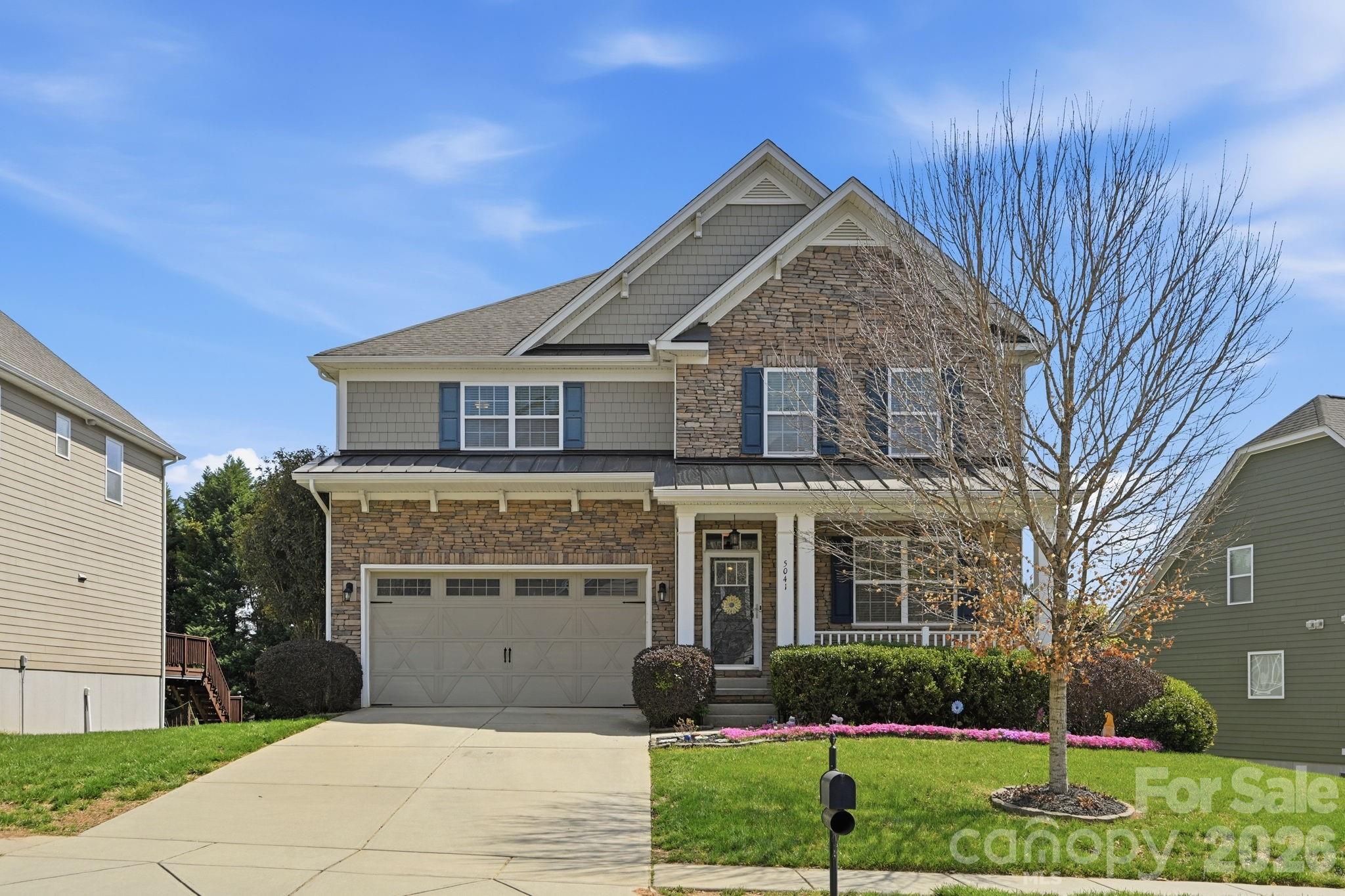 Welcome to The Vineyards on Lake Wylie! New price reduction to $775,000. You won't want to miss this 2-Story Home with WALKOUT FINISHED BASEMENT. This gorgeous home boasts 6 BEDROOMS, with one on the main floor, and 5 FULL BATHROOMS!  This home is an entertainer's paradise!  It has a gourmet kitchen with granite countertops, gas cook top, and a double oven to make every chef happy!  You can enjoy both a large dining room and a breakfast nook. There is a cozy screened in porch to enjoy. Upstairs you will find the Primary Suite with a sitting room and extra-large closet, plus three additional bedrooms, and two full bathrooms, as well as an expansive laundry room.  The basement is a showstopper with a gorgeous wet bar area, perfect for entertaining, as well as a large den. There is 7.1 Surround Sound System with speakers on the patio, the gym/ flex area and screened in porch.  Plus, there is a bedroom and full bathroom in the basement. Wait until you see the STORAGE areas!  You will also love the savings of PAID OFF SOLAR PANELS! WOW!!  The neighborhood offers a multitude of resort style amenities including a boat ramp, boat storage, pool, playground, tennis and pickleball courts, bocce ball court, walking trails, dog park, picnic area, recreation area and clubhouse. This home is conveniently located to Charlotte Douglas International, Uptown Charlotte and the U.S. National Whitewater Center, plus shopping and restaurants. WELCOME HOME!