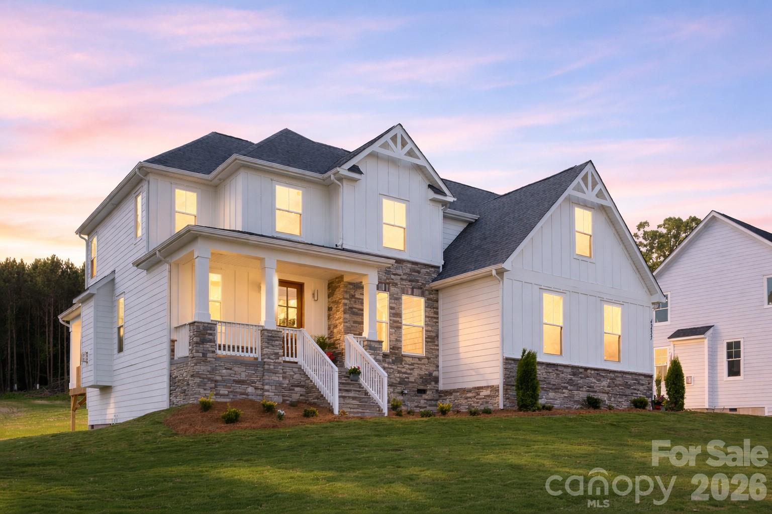 Your Dream Home Awaits! Modern Finishes and LAKE NORMAN ACCESS Lot for community! Kayaking, boat launch and picnic area to enjoy.   Beautifully crafted 4-bed, 3-bath home, 3 car garage with an open floor plan, ideal for both relaxation and entertaining. The spacious primary is conveniently located on the main level, offering privacy and easy access. Enjoy cooking in the gourmet kitchen featuring quartz countertops, large island, stainless steel appliances. a five-burner gas stovetop, wall oven and dish washer. The home’s exterior boasts a perfect blend of stone, board & batten, and lap siding, complemented by a covered back porch—perfect for enjoying the outdoors. Situated on a large lot, the property provides plenty of space to entertain. Additional highlights include a bonus room and or media room for movie nights or gaming. Neighborhood waterfront access lot to the beautiful shores of Lake Norman, ideal for boating, fishing, or simply enjoying the scenic views.  The Mooresville/Sherrills Ford Lake Norman corridor is transforming faster than ever. Within a quarter mile you’ll find a brand-new Publix, Chick-fil-A, Dunkin Donuts, restaurants, and more as this area continues to boom. The main highway, 150, is being widened, schools are highly rated, and new development is reshaping the entire shoreline. This home offers water views and lake/boat access, and sits in one of the last affordable pockets of an area on the rise. Opportunities like this don’t last long.
