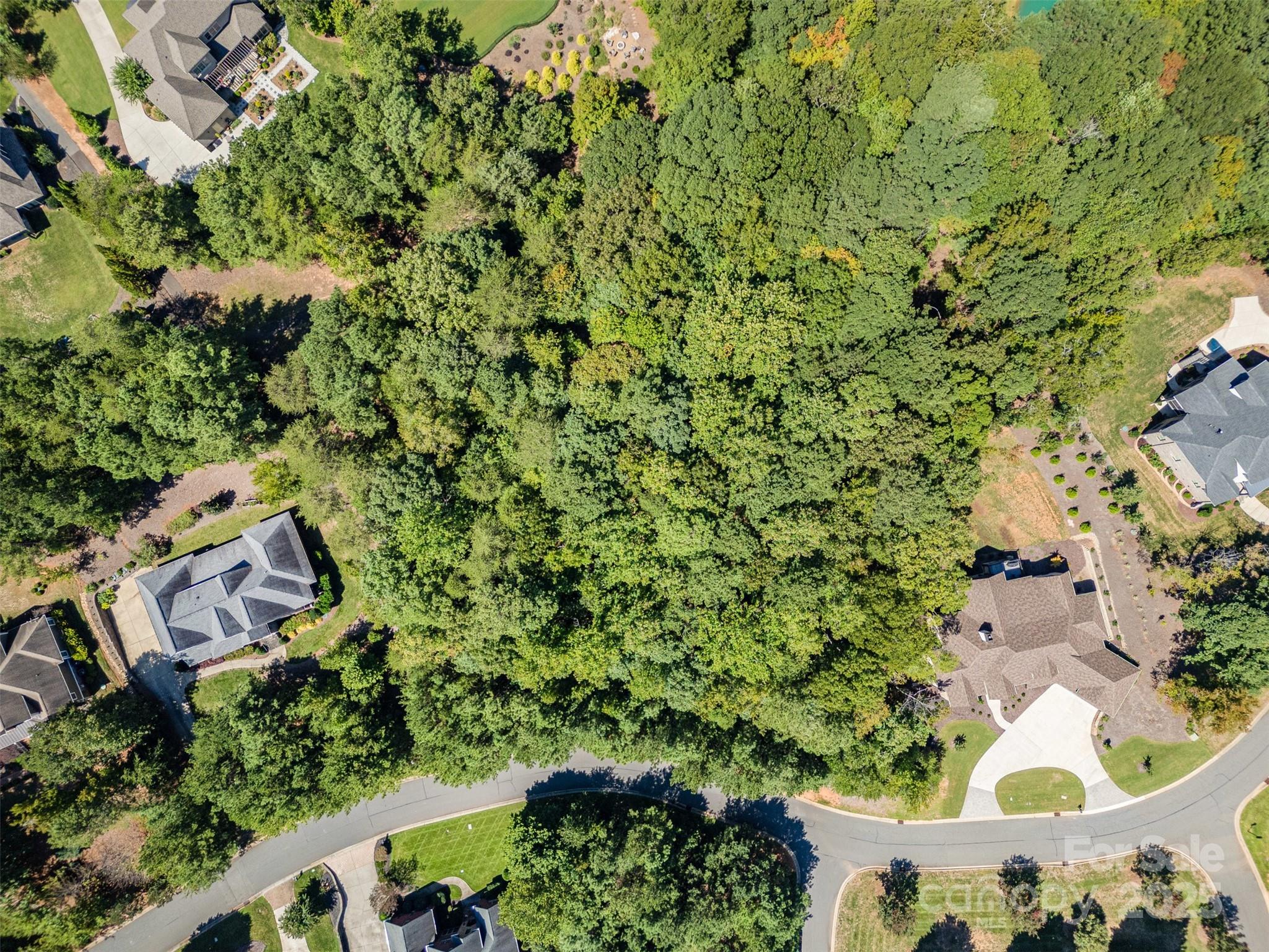 RESORT-STYLE LAKE LIVING on this .81-acre lot in the prestigious, gated community of Reflection Pointe on Lake Wylie! Build your luxury estate home in a peaceful, tree-lined setting designed for ultimate relaxation and recreation. Enjoy resort-style amenities including a clubhouse, swimming pool, ponds, soccer fields, lighted tennis courts, parks, playground, paved walking trails, and RV/boat storage. Watch stunning sunsets from the community’s sandy beach and marina area. Located just minutes from charming Belmont, with its restaurants, shops, college, and the Daniel Stowe Botanical Garden, and convenient to the new CaroMont Regional Medical Center. Build your dream lake retreat today in one of the most sought-after communities on Lake Wylie!