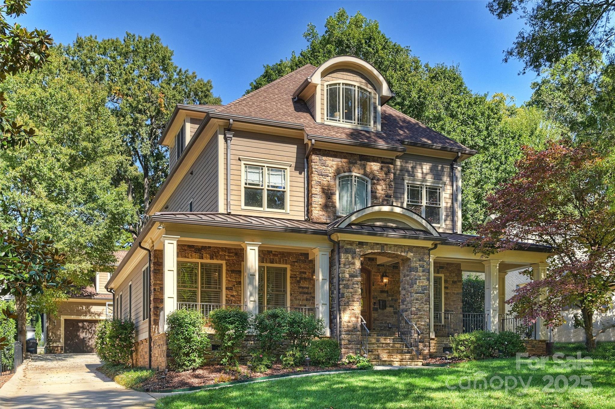 Nestled on a hard-to-find cul-de-sac in one of Charlotte’s most coveted neighborhoods, this exceptional home truly offers it all. The heart of the home is an open-concept kitchen that flows seamlessly into the den and a spacious screened-in porch. The gourmet kitchen boasts an island with breakfast bar, top-tier appliances, and a butler’s pantry complete with a sink, beverage fridge, pantry, and wine cellar.  Conveniently located off the driveway, the large mudroom features custom lockers, built-in desk and a separate laundry room complete with a sink and abundant storage.  The primary suite is a serene retreat, showcasing dual walk-in closets and a luxurious bath with separate tub and shower, dual vanity, and built-ins.  The second floor has three additional bedrooms and two full baths—all with hardwood floors and generous closets.  A versatile third floor offers a bonus space with built-ins, a wet bar, and an additional bedroom and full bath. Above the two-car garage, the in-law suite provides a private haven with its own bedroom, full bath, kitchenette, and living area.  Outdoor living is equally impressive, featuring a fully turfed backyard and a large screened-in porch equipped with heaters and a fireplace—perfect for year-round enjoyment. Ideally located just two blocks from Freedom Park and minutes from Uptown and SouthPark, this home blends luxury, comfort, and convenience in one remarkable setting.