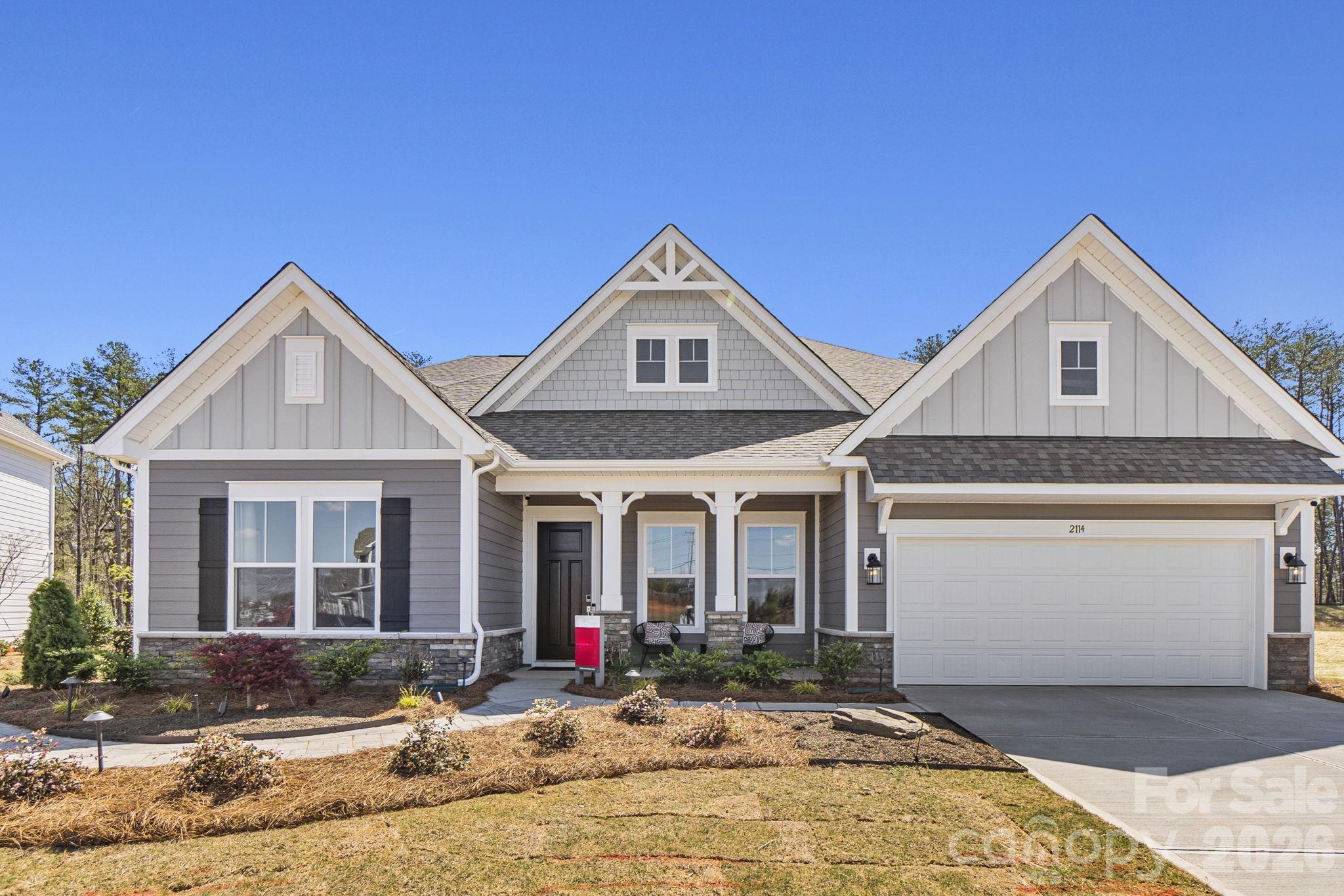 What's Special: Model Home | No Rear Neighbors | Sunroom Included | 1st Floor Primary Suite. Model Home - Available Now for April Closing! Built by America's Most Trusted Home Builder. Welcome to the Whitmore II at 2114 Indigo Branch Road in Estates at Sugar Creek! The Whitmore II model home is a spacious ranch plan centered around an inviting open-concept layout that brings the great room, casual dining area, and a beautifully designed kitchen together with its unique boomerang-shaped island. A formal dining room sits just off the foyer for gatherings that call for a more intimate setting, while a bright sunroom opens to additional outdoor living. The thoughtful layout continues with a flex room tucked down the hall past the primary suite and walk-in closets in both secondary bedrooms, along with a long two-car garage that offers added storage. The primary suite feels calm and restorative with a large walk-in closet, dual sinks, and a generous spa shower. The second floor adds even more versatility with a loft, an attic suite, and unfinished storage that adapts easily to changing needs. Enjoy easy access to I-77, I-485, and Highway 521, plus the highly sought-after Ballantyne Bowl with new restaurants and lively community events. Your new home is also surrounded by natural beauty, with nearby Carolina woods, scenic parks, beautiful golf courses, and more. Additional Highlights Include: tray ceiling at dining room, walk in shower at secondary bath, sunroom with additional outdoor living space, gas fireplace, spa shower at primary bath, loft with attic bedroom suite and unfinished storage space, gourmet kitchen, laundry sink, model home designer finishes, washer, dryer, and refrigerator. MLS#4347113
