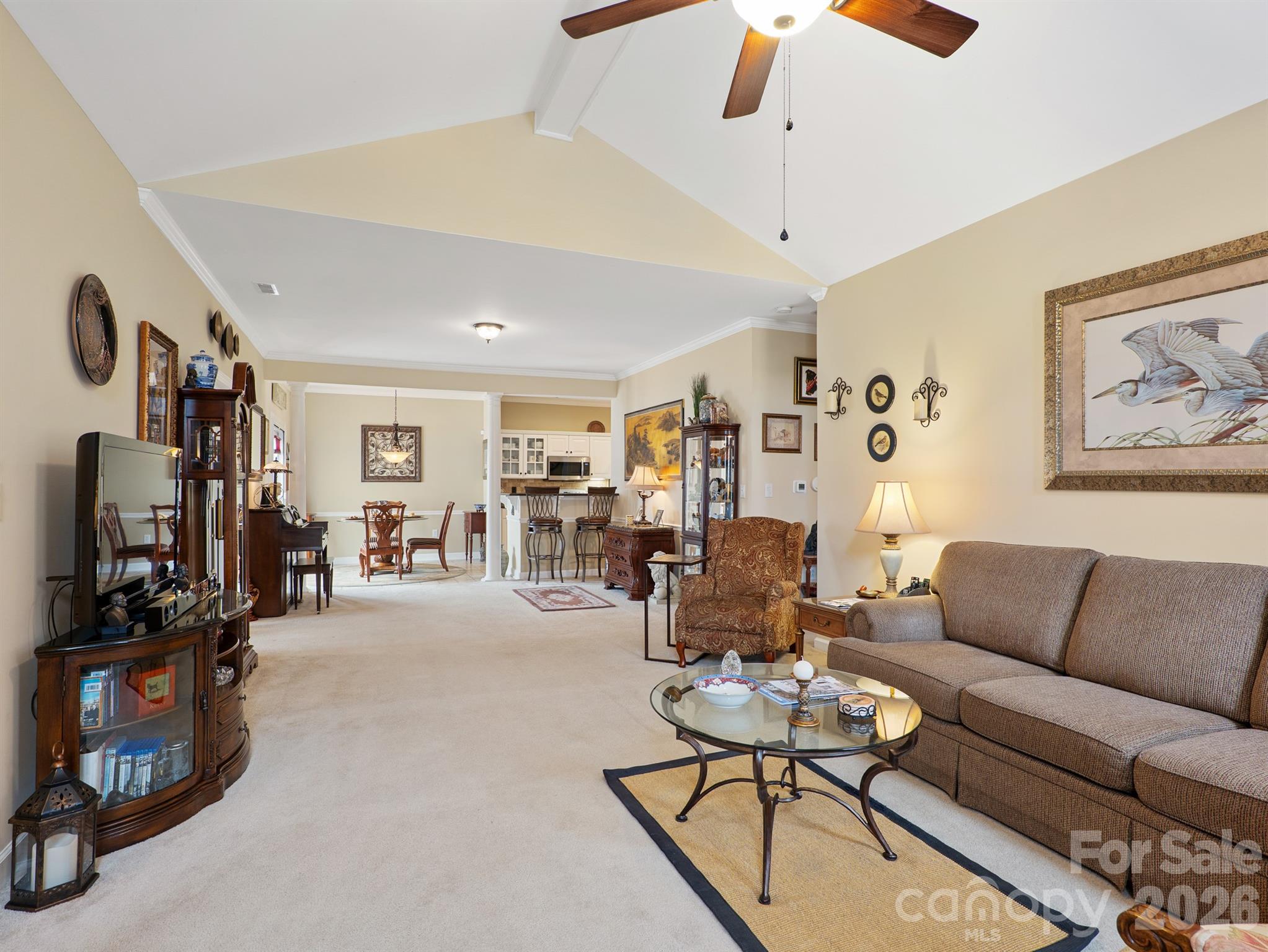 Meticulously maintained 2-bedroom, 2 full-bath patio home with a 2-car garage, located in the highly desirable, The Glen at Highland Creek. Superb location just minutes from I-485 and I-77, with easy access to restaurants, grocery stores, and everyday conveniences. This inviting home features a spacious open-concept living area with a gas fireplace, vaulted ceilings, and plantation shutters throughout. The updated kitchen offers granite countertops, tile flooring, a stylish backsplash, and all appliances convey. The primary bedroom includes a private ensuite bath and generous closet space. A large 2-car garage features an insulated garage door, recently replaced in 2025. As a bright corner unit, the home is filled with natural light. Outdoors, enjoy a private fenced patio—perfect for relaxing or entertaining while enjoying the peaceful surroundings. Special assessment to replenish HOA reserves, paid by Seller. Private roads maintained by HOA. Water/Sewer, exterior lawn maintenance, termite ,trash included in HOA. Contact Community Assoc Management with any questions.