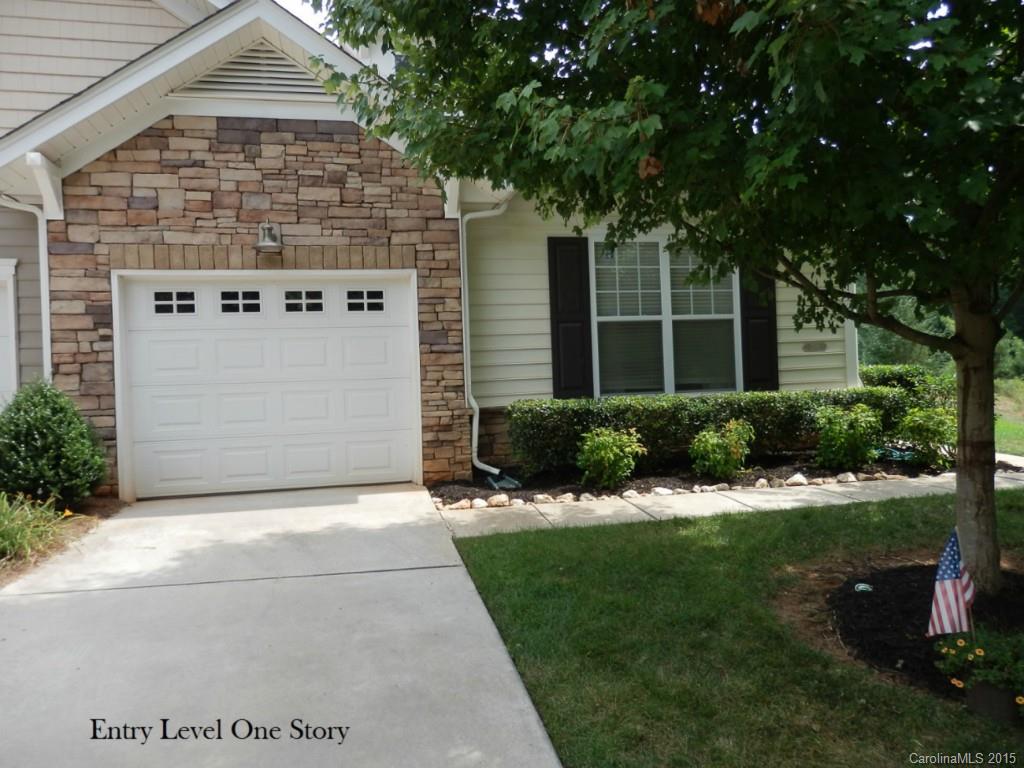 ***Private End unit on very end of the street, wooded area and tranquil pond w/ fountain on back and side yard***  Appliances stay including brand new Range Top Microwave and Flat Top Stove, Stackable Washer/Dryer.  Large main Bedroom w/ huge walk in closet, dual bathroom sinks, separate office, laundry room can fit full size machines, fresh paint throughout. Booming Indian Land w/ top rated schools and 2 large shopping complexes approved and ready to start construction including movie theatre.