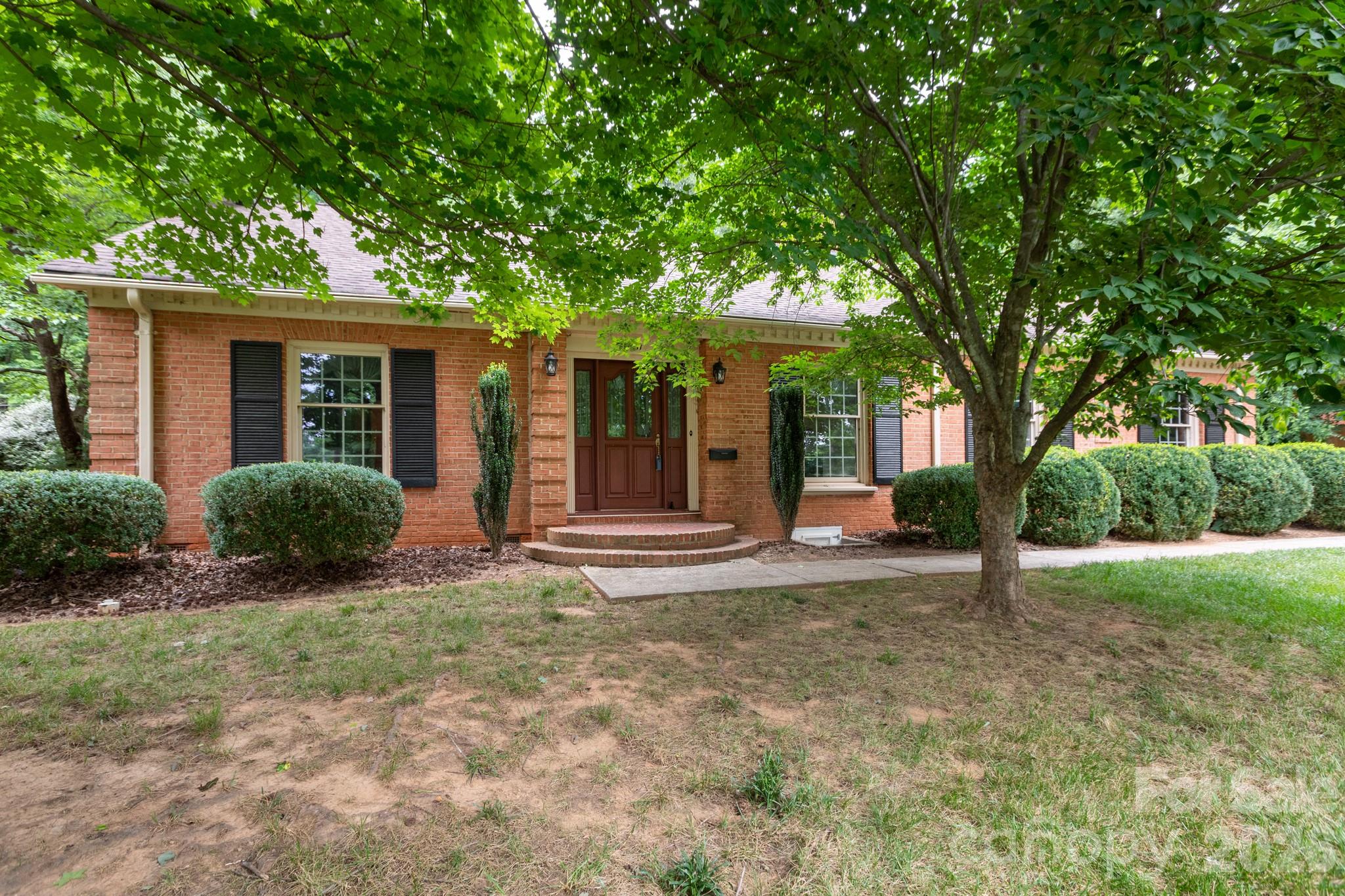 Nestled on a quiet, tree canopied street in Charlotte's highly desirable Sherwood Forest neighborhood, this classic brick ranch offers timeless appeal, generous living spaces, and an exceptional opportunity to make it your own. Featuring five bedrooms and two-and-a-half baths, the home blends traditional character with a flexible floor plan designed for comfortable everyday living and entertaining.

The welcoming formal living room showcases original hardwood floors and a gas fireplace, while the adjoining dining room provides a comfortable setting for gatherings and holiday celebrations. The kitchen includes a breakfast area perfect for casual meals and morning coffee, and the paneled den offers a warm, inviting retreat with its own fireplace and abundant space for relaxation.

A spacious sunroom overlooks the level backyard, creating an ideal space for enjoying natural light year-round. Original hardwood floors throughout much of the home add warmth and authenticity, while the carport provides convenient covered parking and storage.

Set on a beautifully level lot, this property enjoys all the benefits of Sherwood Forest living—mature trees, established homes, walkable streets, and a prime location just minutes from Cotswold, SouthPark, Uptown, top-rated dining, shopping, parks, and everyday conveniences.

Lovingly maintained and full of potential, this home presents a rare opportunity to enjoy one of Charlotte's most sought-after neighborhoods while adding your personal style and updates over time. Whether you're looking to preserve its classic charm or create your dream home, the possibilities are endless.
