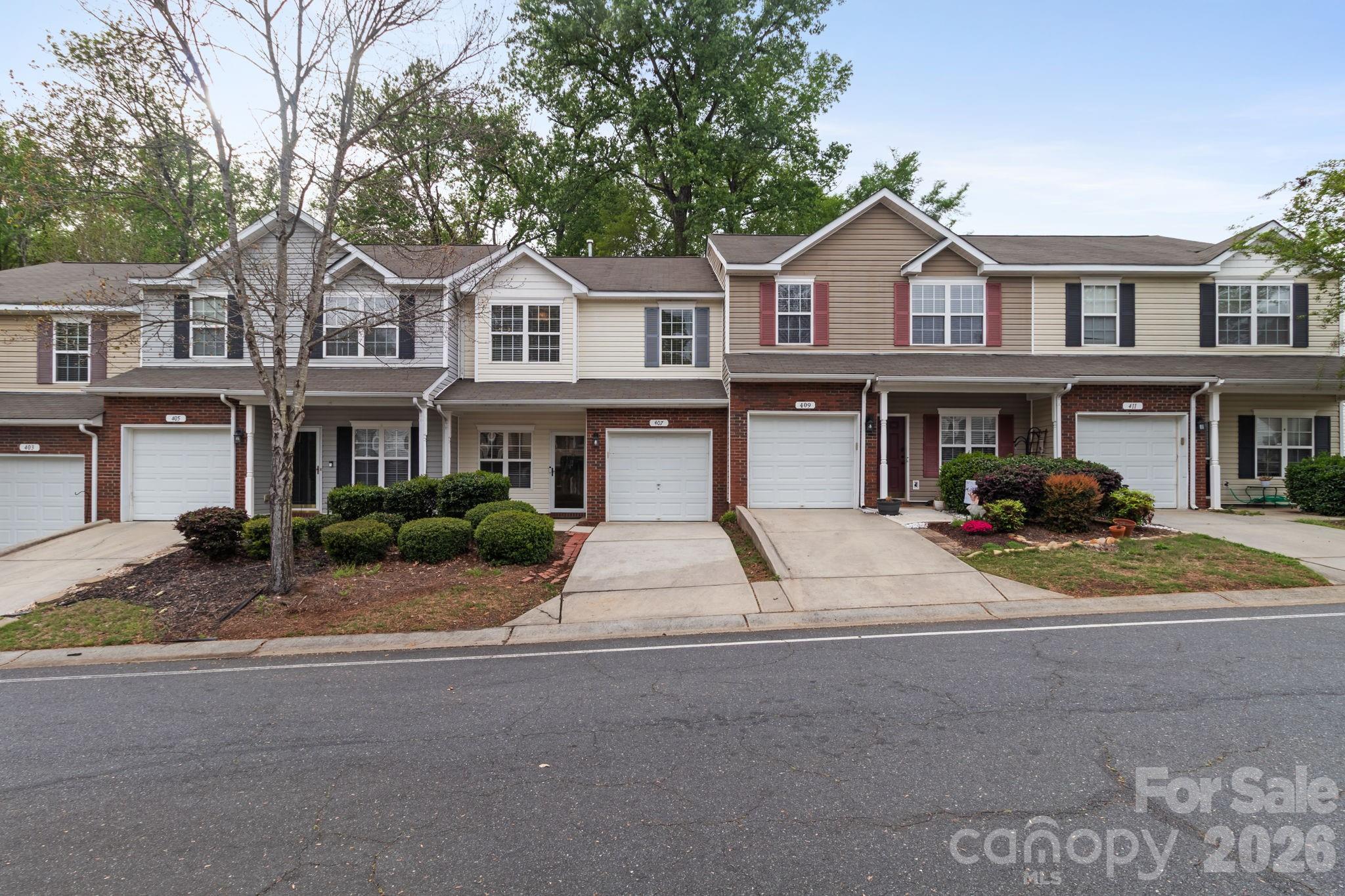 Quaint community in the convenient Fort Mill and Lake Wylie area. Award winning schools! This 2 bedroom 2.5 bath plus loft and single car garage townhome will not disappoint! Newer appliances include LG high end refrigerator, ultra slim microwave and split oven (two sides). Updated lighting, engineered hardwood flooring has all been done for you. HVAC system new in 2022.  Bring nothing but your belongings, washer and dryer included. HOA amenities include. Comm pool and walking trails and street lights.  Water and trash included in HOA dues. Two nice sized bedrooms, primary with en-suite and another full bath up. Private rear yard complete with deck for outdoor entertaining or grilling. Close to 77, parks, Kingsley Shopping, Baxter Village, and dining.