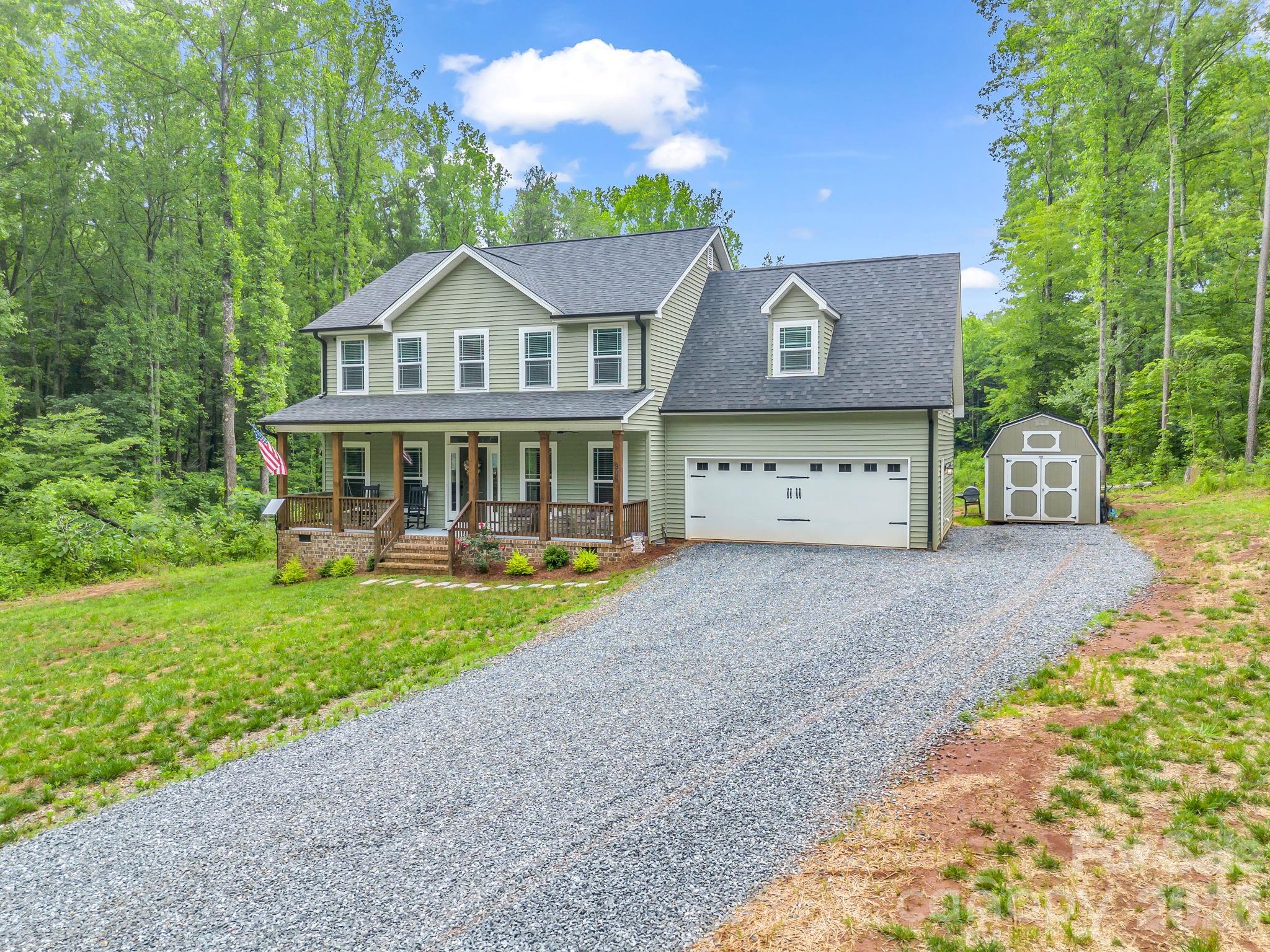 Welcome to your own private oasis! This stunning 2,541 sf home, built in 2024, sits on a beautiful 1+ acre lot offering peace and privacy but modern comfort with no city taxes.  This property offers the best of both worlds. It is tucked away from the hustle and bustle but still conveniently located close to schools, shopping and dining. Enjoy spacious, open floor plan, contemporary finishes with granite and quartz countertops in kitchen, farmhouse sink, double oven, self closing cabinets, large pantry & laundry room, gas fireplace in family room, LVP in downstairs main areas, hardwood flooring on stairs, carpet in the bedrooms, large primary bedroom, private water closet in bathroom along with dual sinks, a bricked primary shower, soaking tub and two large walk-in primary closets. Step outside and enjoy the spacious 20x20 deck, perfect for entertaining guests, grilling out or simply relaxing while overlooking the peaceful surroundings. If you want luxury, convenience and seclusion, this house is for you!