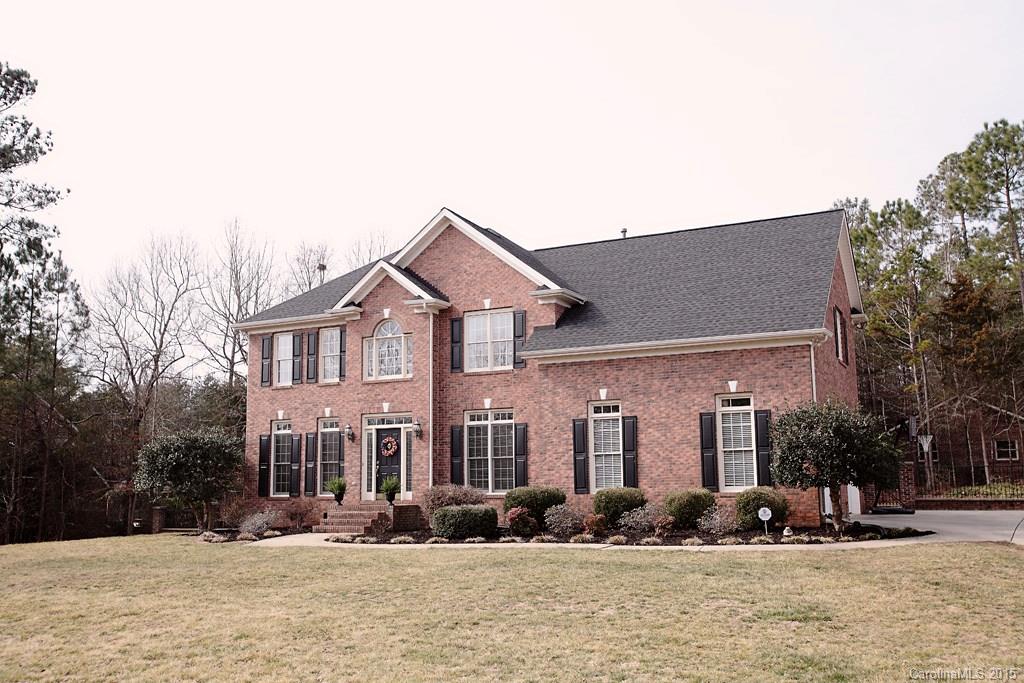 Nestled beautifully on 1.15 acres of land just minutes from the new Doby's Bridge bypass, this Huntington Farms all brick home will leave you breathless.  BRAND NEW renovated gourmet kitchen with stainless steel appliances is perfect for the cooking enthusiast and entertaining.  Custom built-in entertainment center as well hardwoods throughout the main floor.  New TANKLESS water heater.  Fridge and washer/dryer included!  This home also leads to an awesome detached workshop.  Won't last long!
