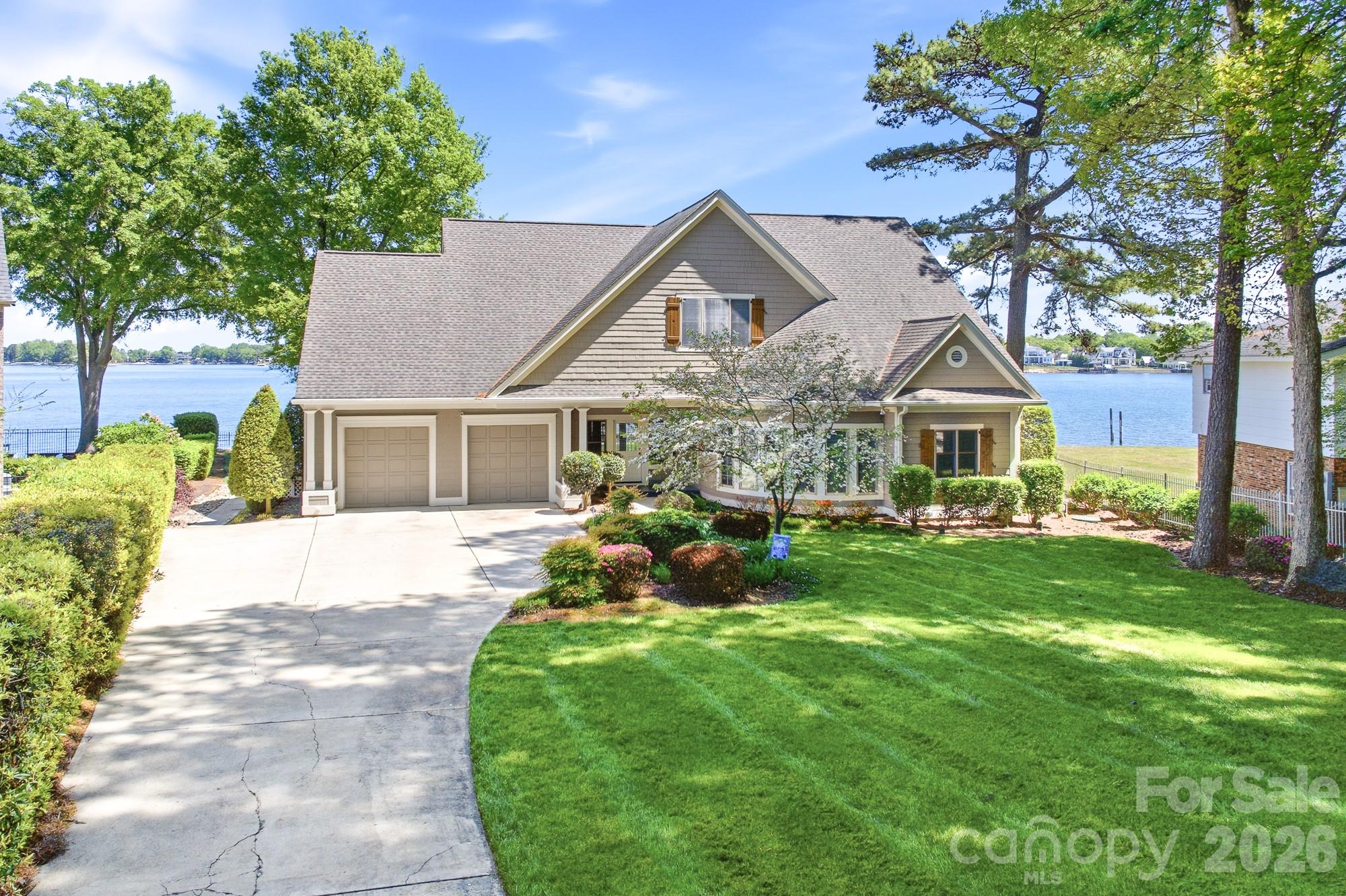 Stunning cedar shake waterfront retreat with breathtaking panoramic views of Lake Norman. This impeccably maintained home blends timeless charm with refined comfort, featuring rich hardwood floors, a dramatic stone fireplace, and walls of windows that flood the interior with natural light while showcasing the water from nearly every angle.

Designed for effortless indoor-outdoor living, enjoy peaceful mornings and unforgettable sunsets from the spacious screened porch and covered terrace overlooking the lake. 

The waterfront experience is truly exceptional, complete with a private pier, boat lifts, seawall, and a picturesque boardwalk—perfect for embracing the ultimate Lake Norman lifestyle. 

Inside, the home offers 4 bedrooms, 3.5 baths, and approximately 3,708 square feet of thoughtfully designed living space. The expansive upper-level bonus room provides incredible flexibility for a media room, home office, or guest retreat.

A rare opportunity to own a private waterfront retreat with spectacular views and premium features!

See Upgrade List in Attachments.  Currently verifying if there is room for a pool.