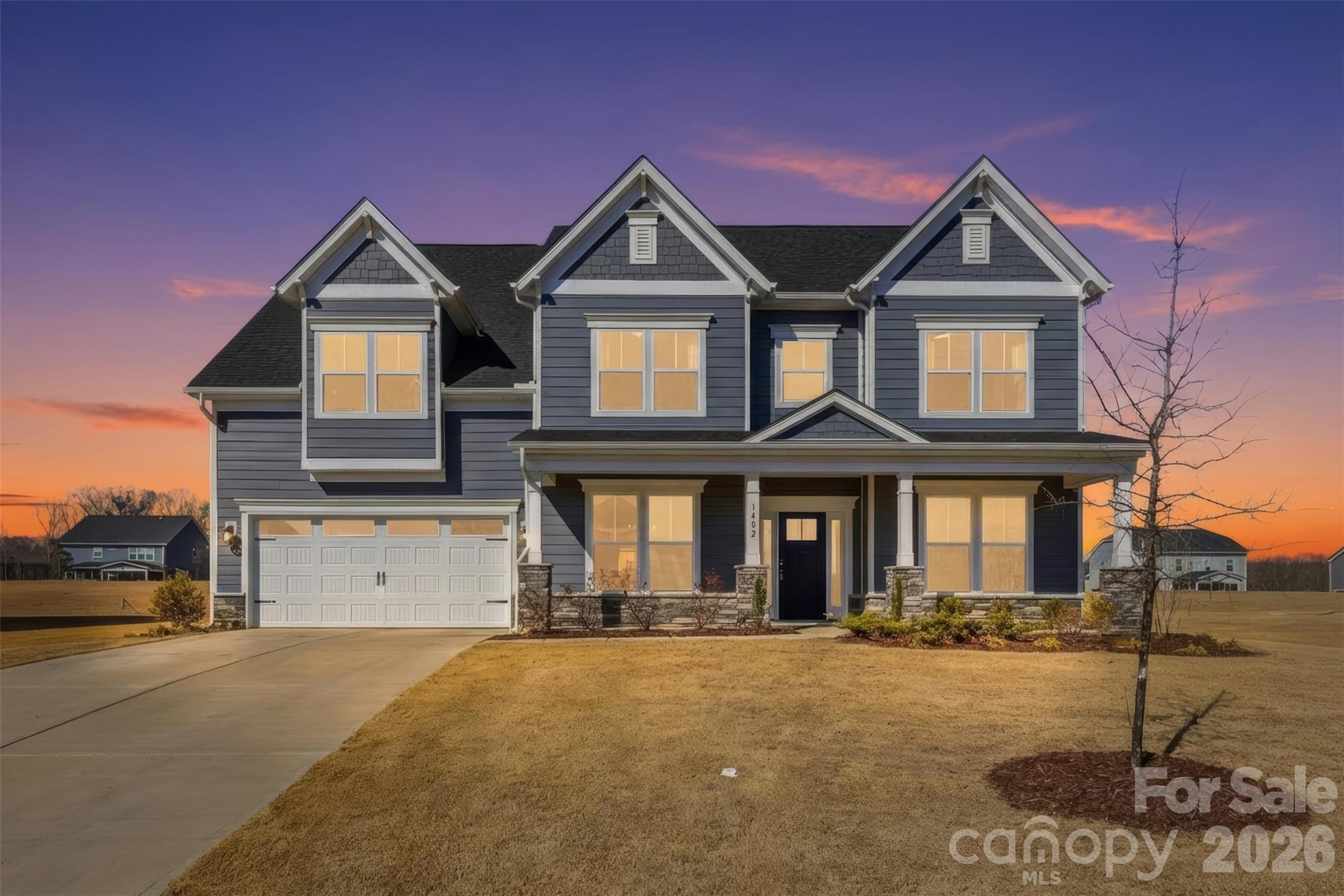 Step into luxury through a grand two-story foyer in this like-new 5-bed, 4.5-bath home on a spacious lot. it feels like top-of-the-line finishes throughout. The gourmet kitchen features stainless steel appliances, quartz countertops. The open family room boasts a raised-hearth fireplace and beautiful coffered ceilings , while an oversized office with double doors offers privacy. Oversized sunroom makes the home more beautiful. A large bonus room provides extra versatility. The upstairs primary suite includes a private sitting room, and a second primary or guest suite is conveniently located on the main level. Located in a sought-after Indian Trail/Mint Hill neighborhood, this home is the perfect blend of elegance, comfort, and modern design. Amazing yard backing to private wooded area. Easy access to interstate 485, shopping dining and entertainment.