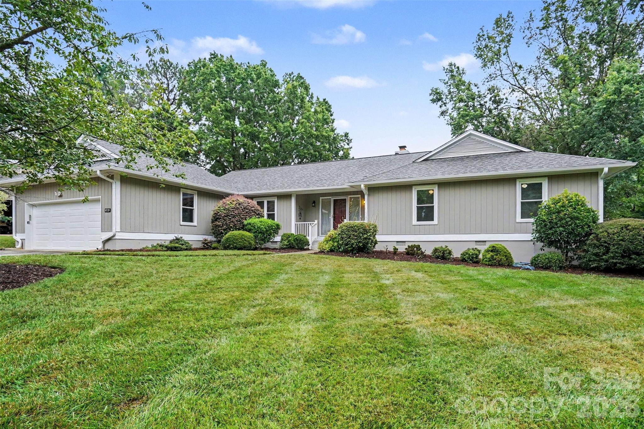 Location, Location, Location! This charming 3-bedroom, 2-bath ranch is full of character and tucked into the highly sought-after Raintree neighborhood. Recent updates include a freshly painted exterior, encapsulated crawlspace, and newer roof (2018) — major-ticket items already taken care of. Step inside to an open floor plan anchored by a cathedral ceiling and beautiful pre-finished engineered hardwood floors throughout. A versatile bonus/flex room offers endless possibilities, whether you need a home office, playroom, or extra living space. Out back, a private screened deck creates the perfect spot for entertaining or simply unwinding. The oversized 2-car garage adds even more everyday convenience.

A truly rare advantage: the new owner receives a waived $30,000 initiation fee to Raintree Country Club — instant access to one of Charlotte's most established private club communities, complete with two championship 18-hole golf courses and the vibrant lifestyle Raintree is known for.
Ideally located in South Charlotte, this home is zoned for top-rated schools and offers easy access to I-485, Providence Road, and Highway 51. Enjoy being just minutes from premier shopping and dining at Waverly, The Arboretum, Promenade on Providence, and Ballantyne.