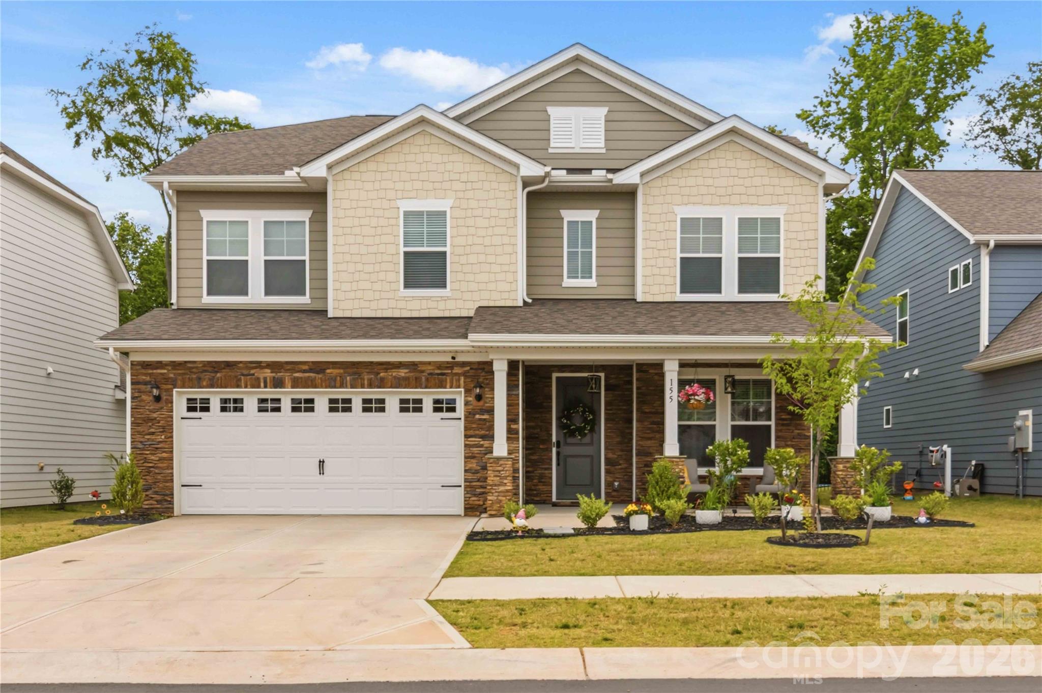 Welcome to McFarland Estates, a premier, nearly new home in the rapidly growing area of York, SC. This exceptional Millbrook floor plan is set apart by significant custom upgrades, offering modern luxury and true turn-key convenience. The home features designer accents. The interior is designed for entertaining, starting with a main-floor guest bedroom complete with a private en-suite. The gourmet kitchen is a chef's delight, boasting woodgrain cabinets, quartz countertops, a gas range, and a spacious island, all flowing seamlessly into the dining and family rooms. The oversized walk-in pantry has been enhanced with a custom organization system, adding incredible storage capacity. Upstairs, luxury meets organization. The expansive primary suite features a generous en-suite and a large walk-in closet, also professionally fitted with a custom closet system. Two additional secondary bedrooms have received the same treatment with custom closet systems, and the second floor also includes three full bathrooms, a laundry room, and a flexible loft space. Outdoor living is exceptional with a stunning raised patio and custom fire pit, creating a perfect gathering space for year-round enjoyment. The backyard is already fully fenced, offering privacy and peace of mind. Experience the best of the tranquil McFarland Estates community, conveniently located near shopping and dining, in a home that's better than new!