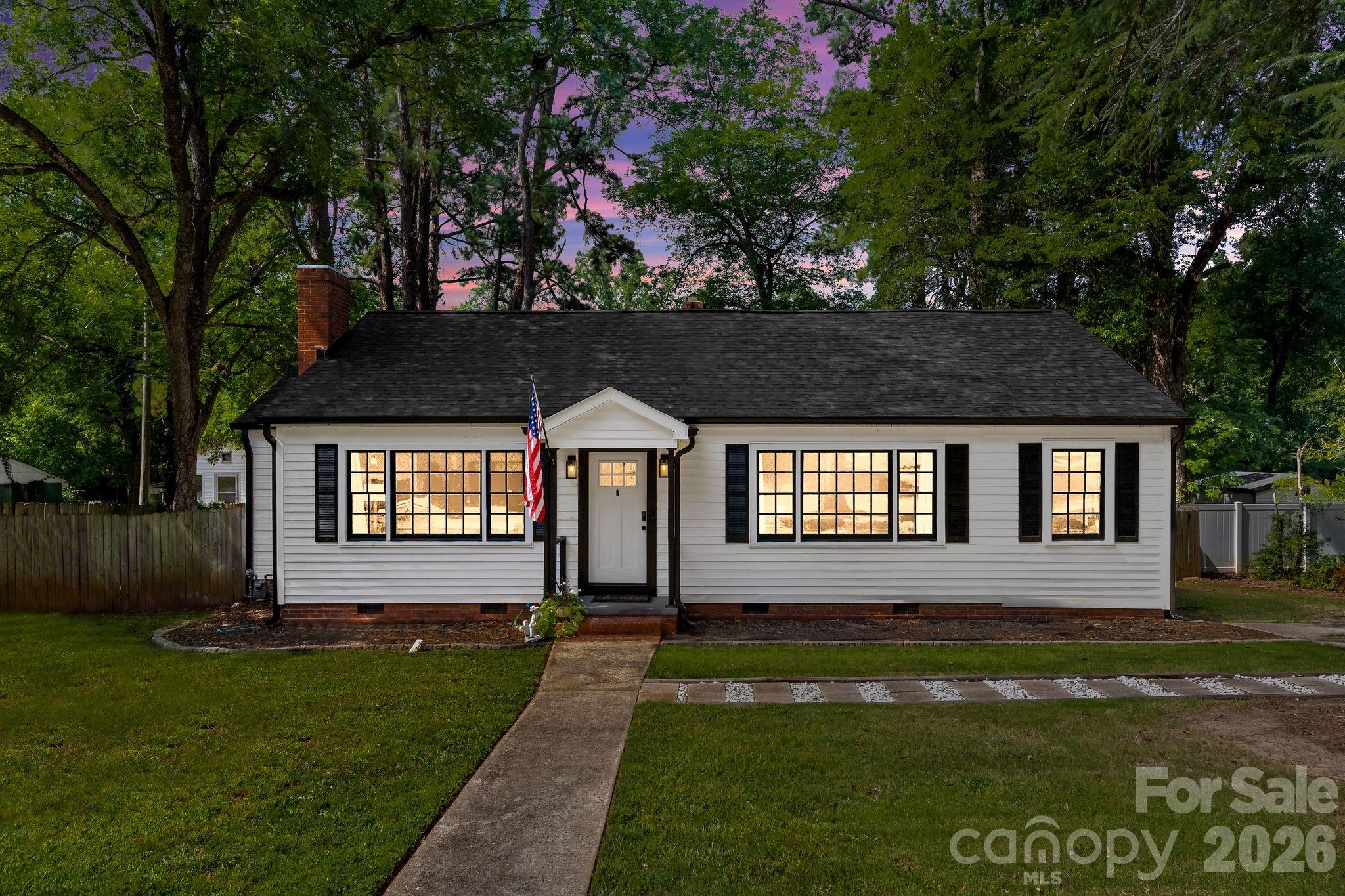 Charming 2-bedroom, 2-bath cottage-style ranch in the heart of downtown York! This 1,373 sq ft home offers great curb appeal with a covered front porch, mature shade trees, and a level 0.40-acre lot just steps from downtown's shops and restaurants. Inside, an updated kitchen features stainless appliances and a cheerful color palette, while the dining area's built-in bar cabinetry adds character. The primary suite includes a sliding barn door and ensuite access. Notable system updates include a new roof (2025), gutters (2024), electrical panel replacement with GFCI upgrades, and PEX repiping — real peace of mind for buyers. Out back, enjoy a spacious covered deck with a ceiling fan, plus a private, wooded backyard with a dedicated fire pit area strung with lights — an entertainer's dream. Upstairs is where this home really stands out: a surprisingly spacious, fully finished bonus level with carpet, closets, and its own window A/C — currently reached by ladder, but with real potential to become true additional living space with the addition of a staircase (not included in square footage as-is; buyer to verify feasibility). Walk to downtown York's restaurants, coffee shops, and historic Congress Street. A fantastic opportunity for a first-time buyer, downsizer, or investor looking for a low-maintenance home with room to grow.
