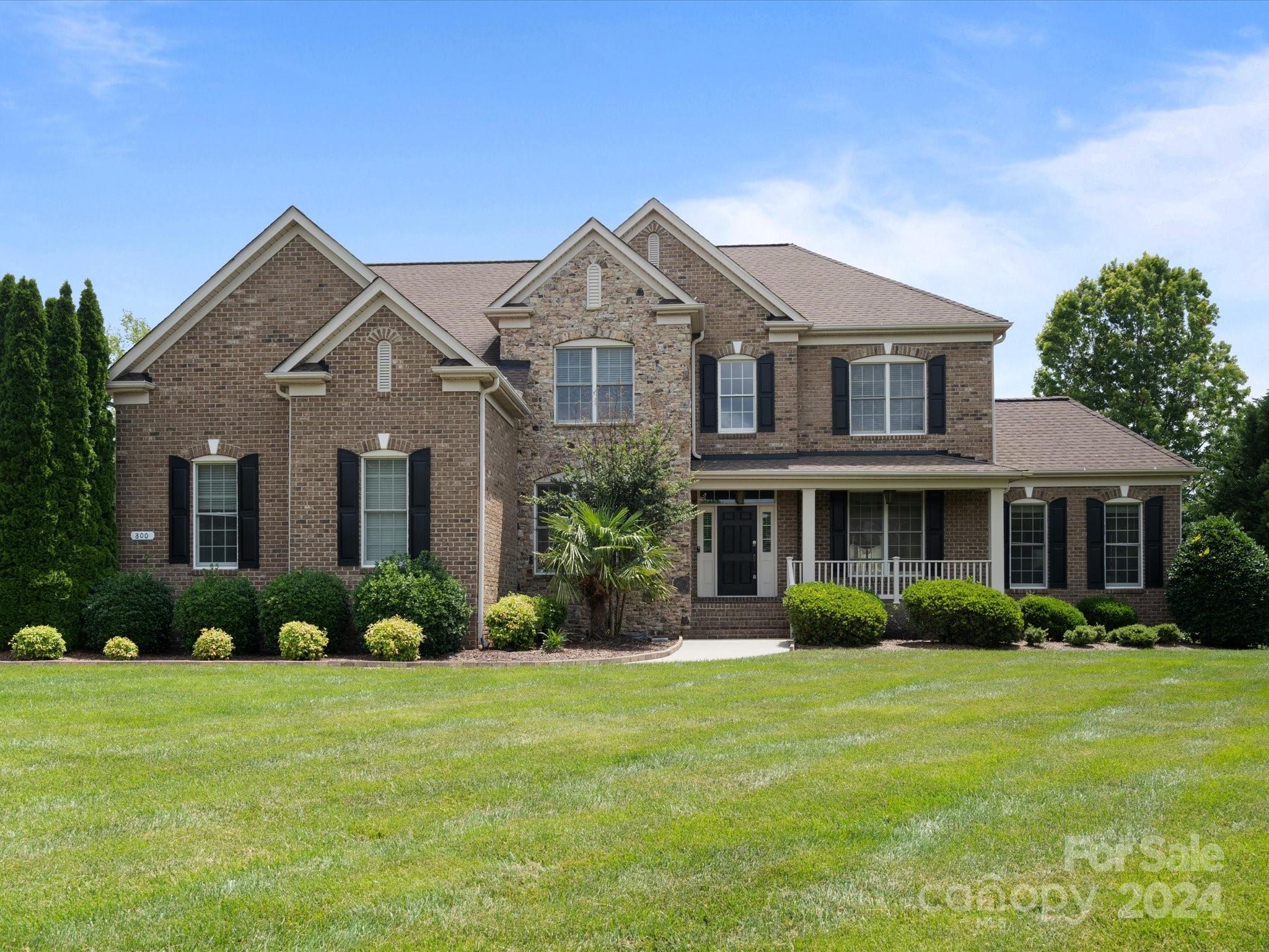 This stunning full brick home is nestled in the highly sought-after Marvin Creek neighborhood! The backyard is true retreat featuring a patio and large screened-in porch, an outdoor kitchen, basketball court, and a gorgeous outdoor fireplace with a waterfall feature. The kitchen boasts granite countertops, a large island with seating, ample cabinet space, and stainless steel appliances. The first floor includes a guest suite and office and the primary ensuite offers a large walk-in shower with frameless doors and custom closet built-ins. The neighborhood offers a wealth of amenities including an outdoor pool, fitness center, tennis courts and more. Marvin is one of NC's fastest-growing communities, known for its top-rated schools and commitment to greenspace preservation, yet it's just minutes from Ballantyne and South Charlotte. Don't wait on this one—schedule a showing today!
